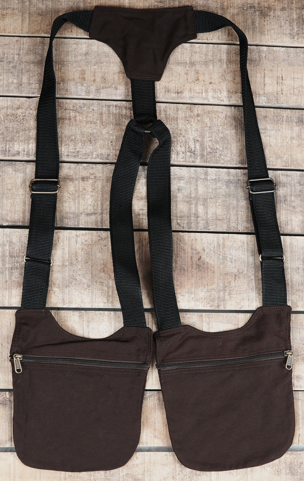 Handmade black chest harness bag with metal details