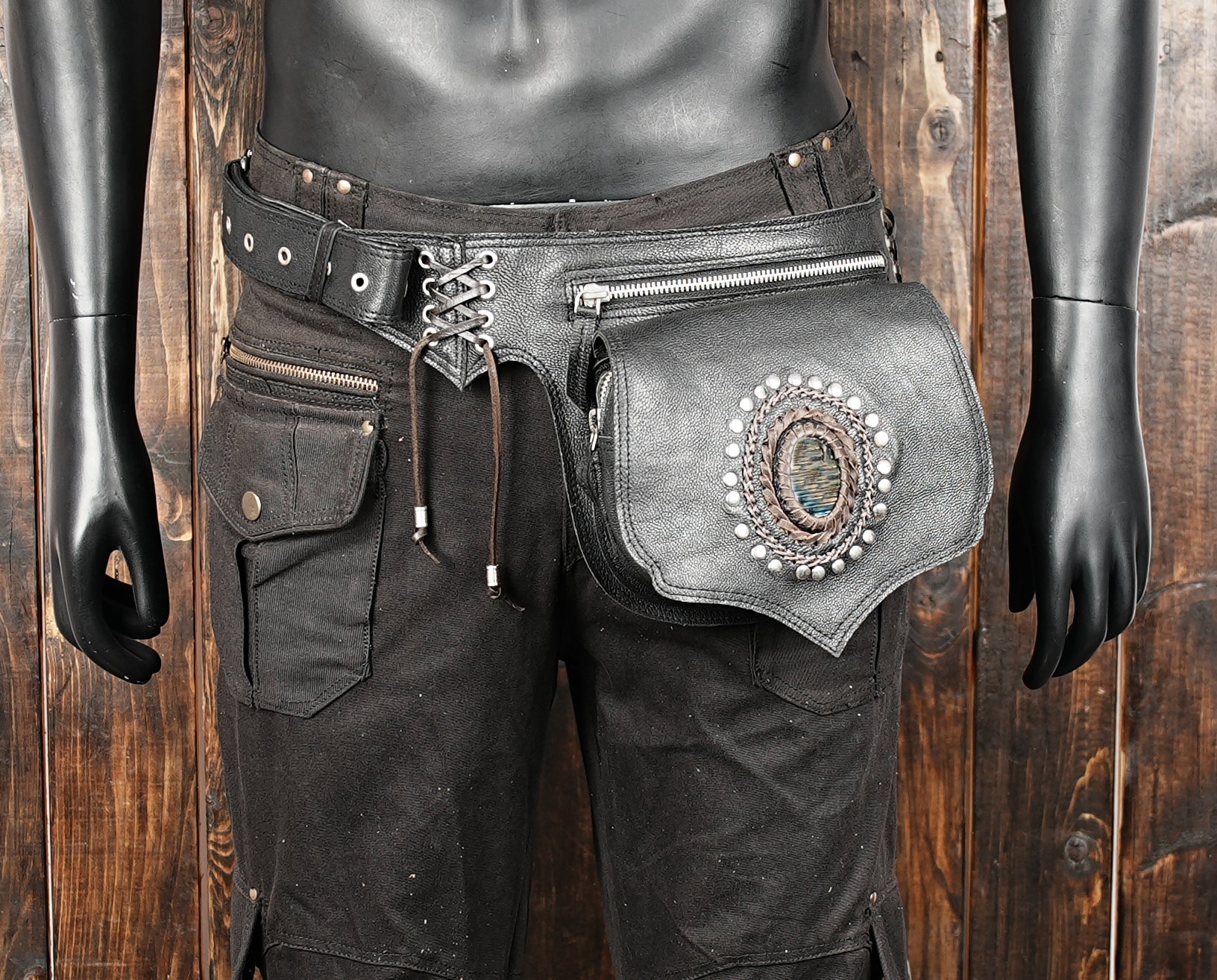Luxury black waist pouch with gemstone front and secure zippered pocket.