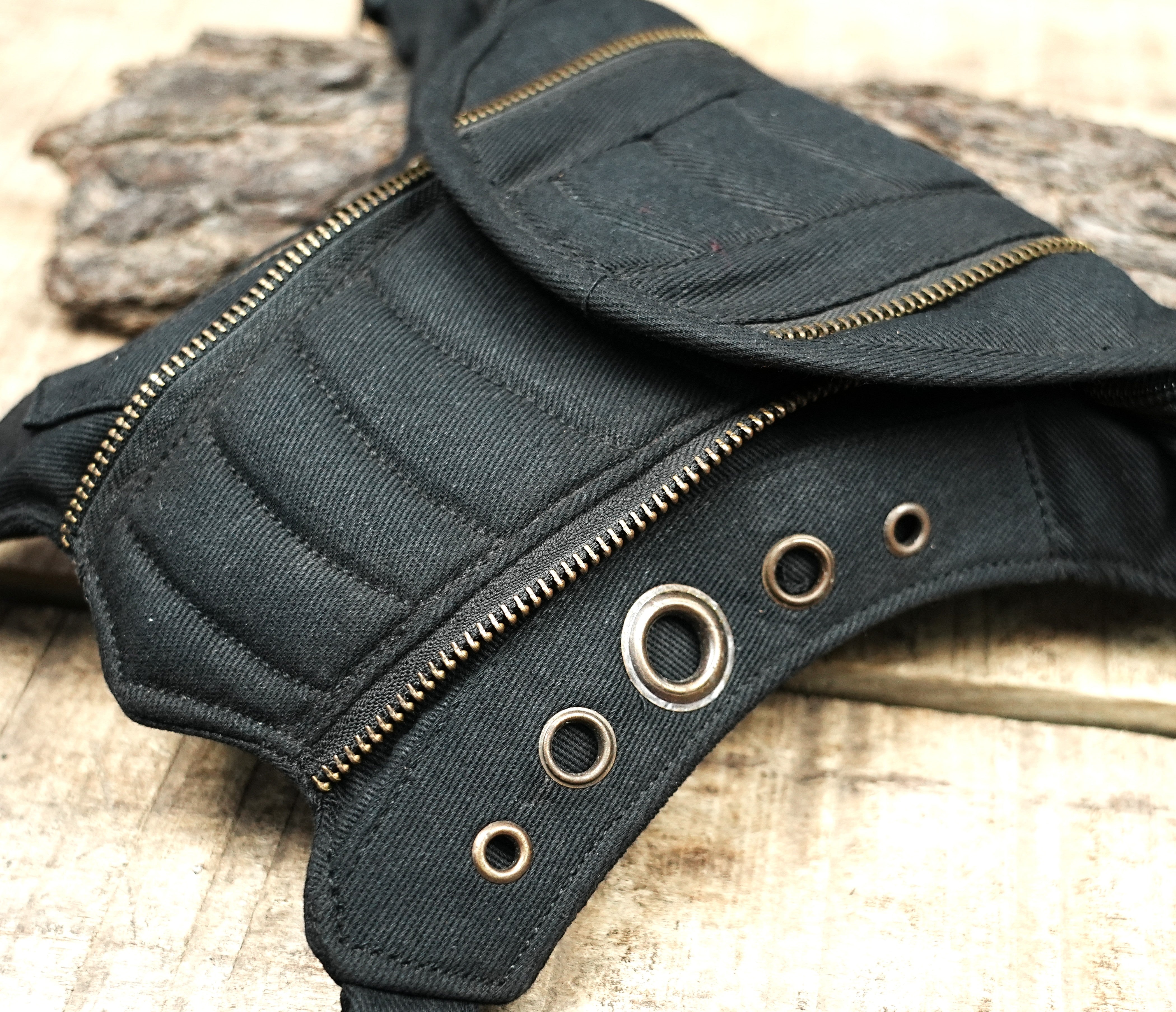Steampunk fanny pack with multiple zip pockets and eyelets