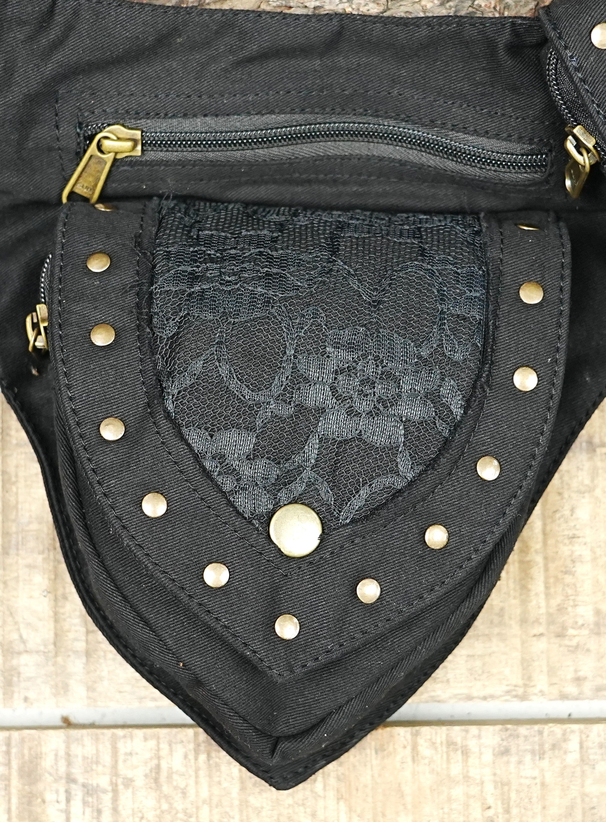 Asymmetric festival hip bag in sturdy canvas with dark lace pocket flaps