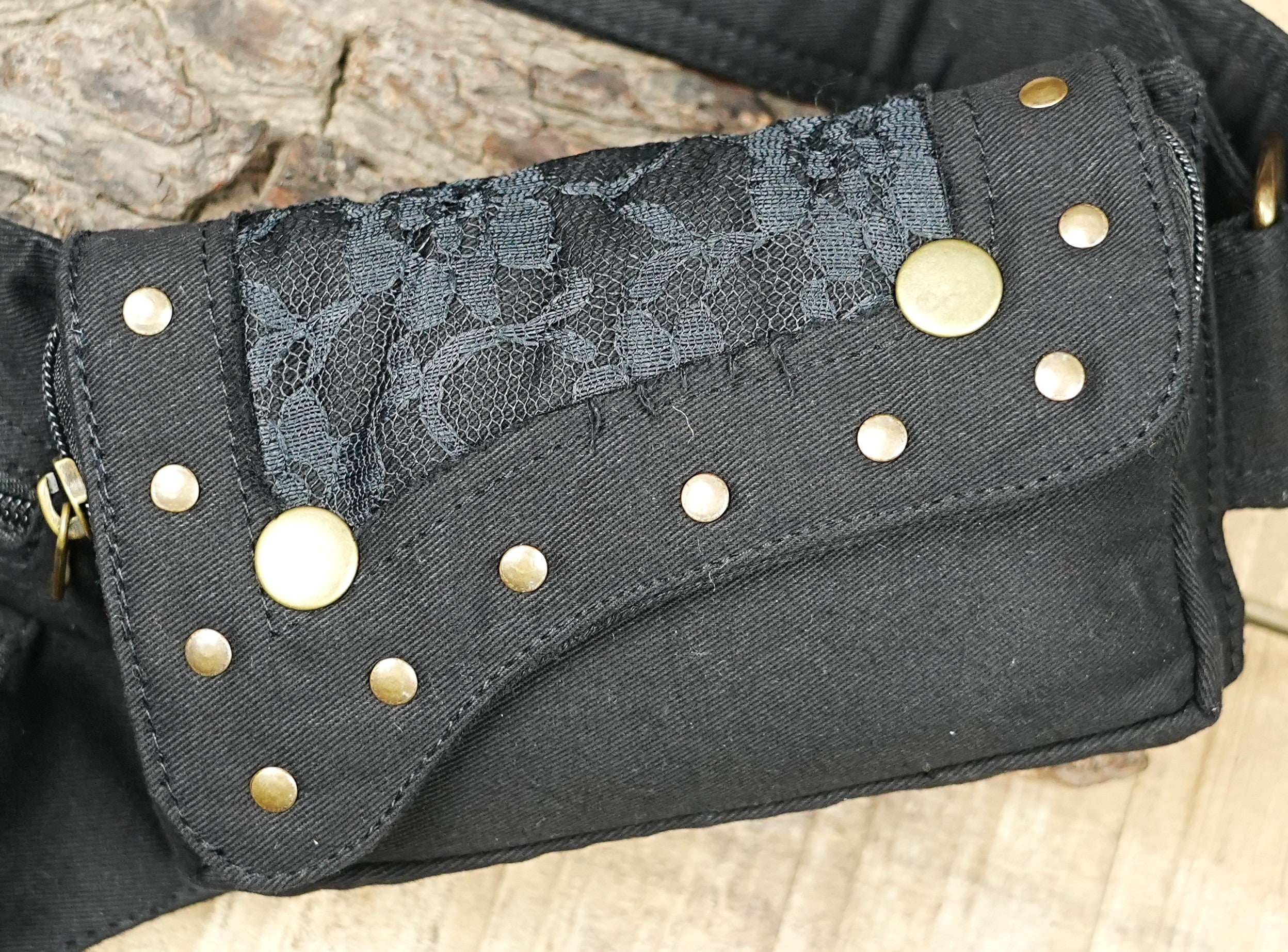 Studded pixie pocket belt with brass zippers and grommet eyelet strap