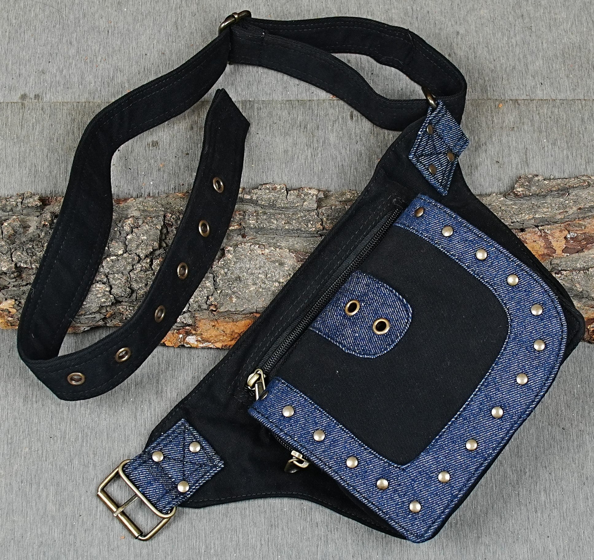 Black cotton waist bag with blue jean patch and metal rivet accents