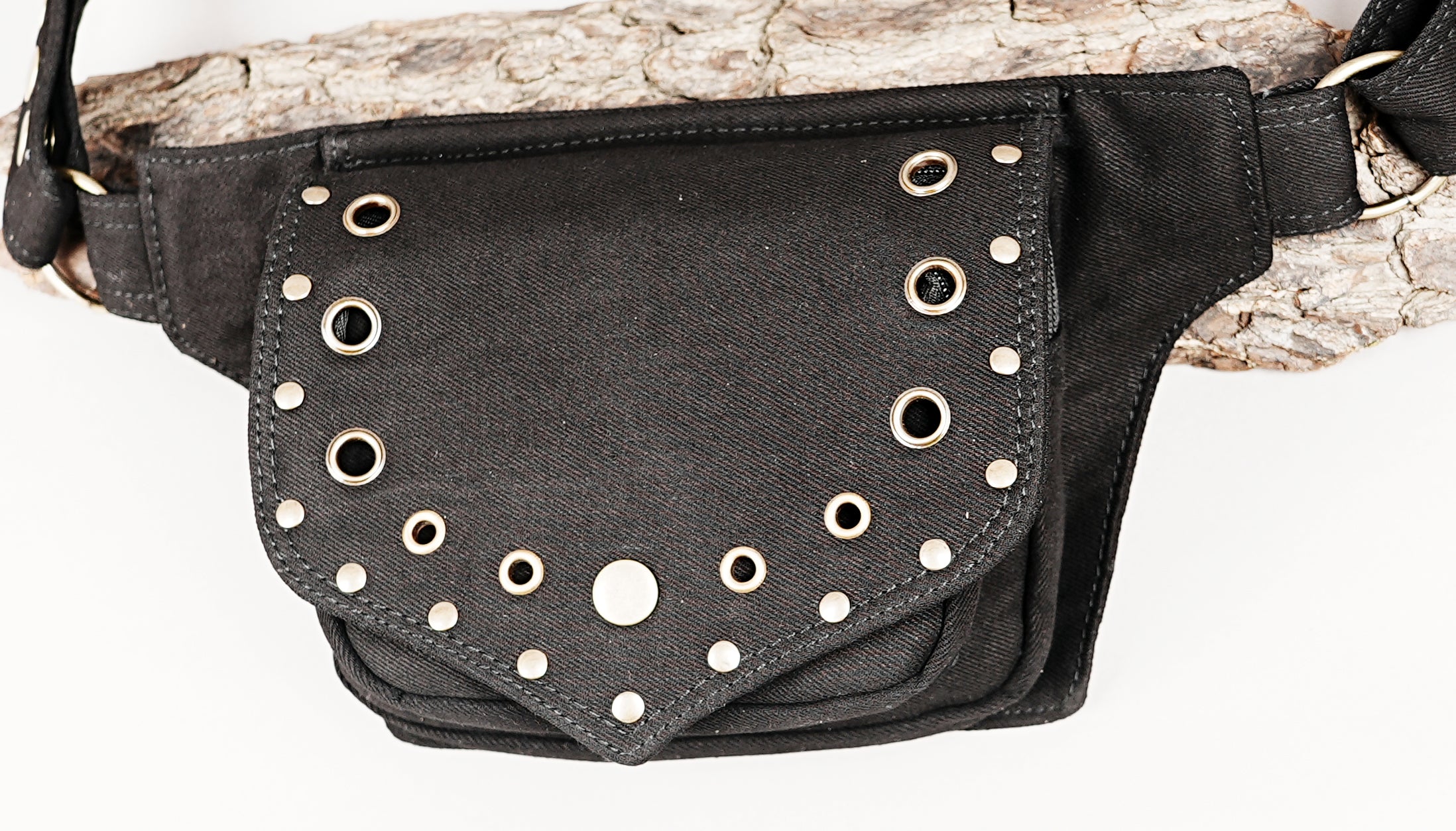 Black waist bag with metal grommets and zipper pocket