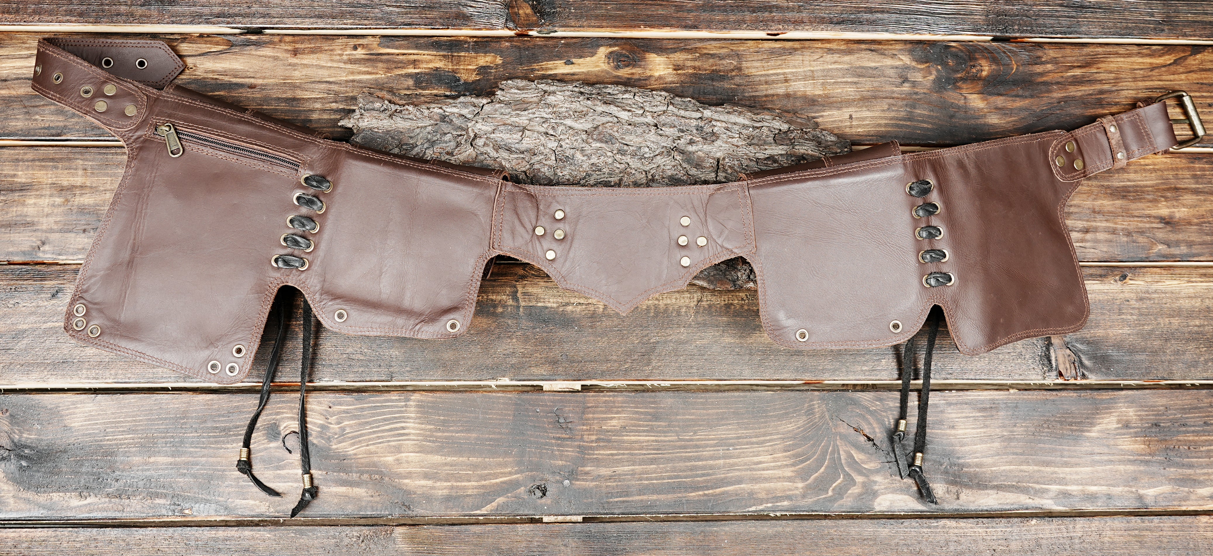 Durable brown leather waist bag with unique flap closures