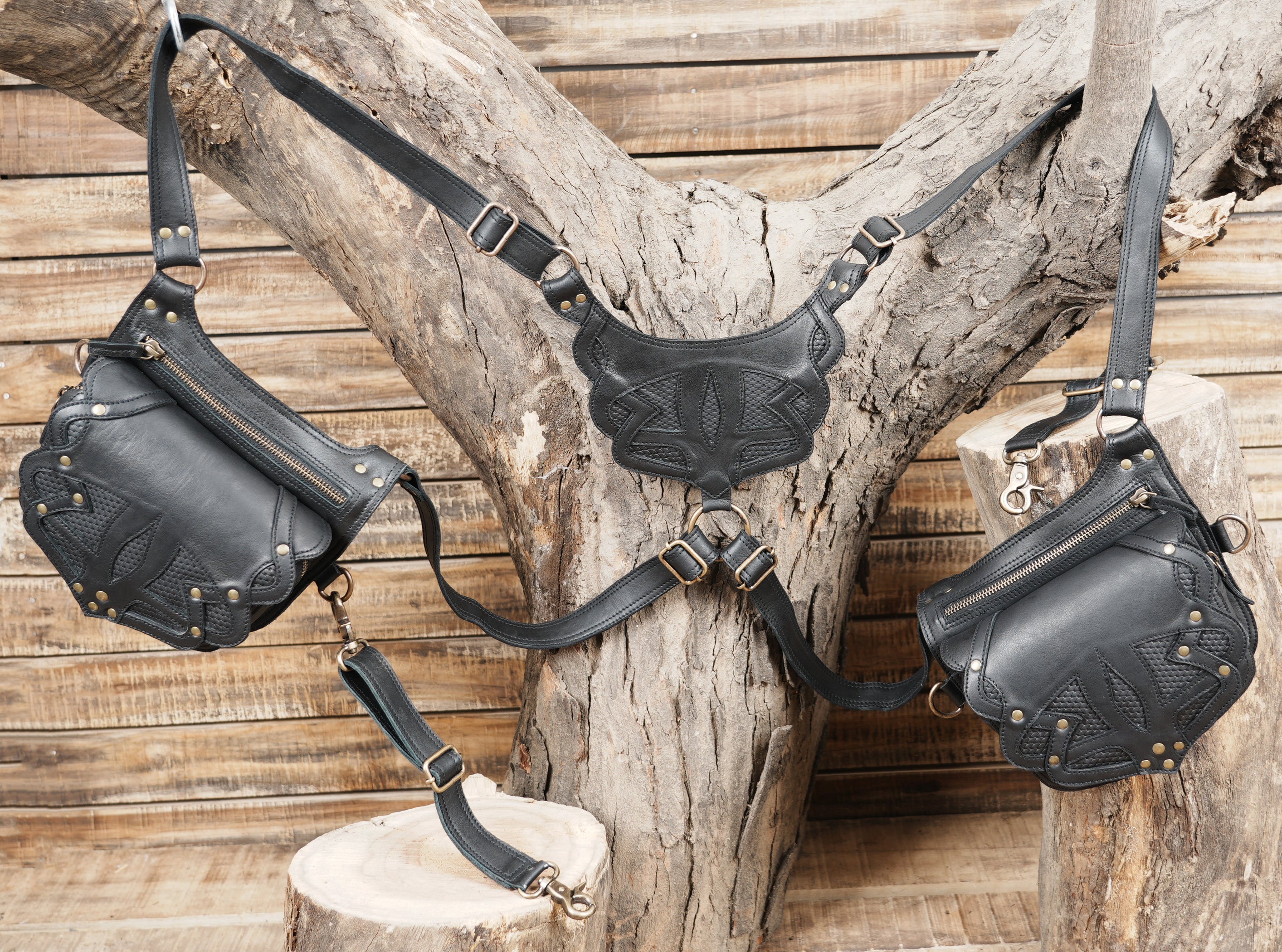 Black leather double pouch holster with tribal embossed design and adjustable straps
