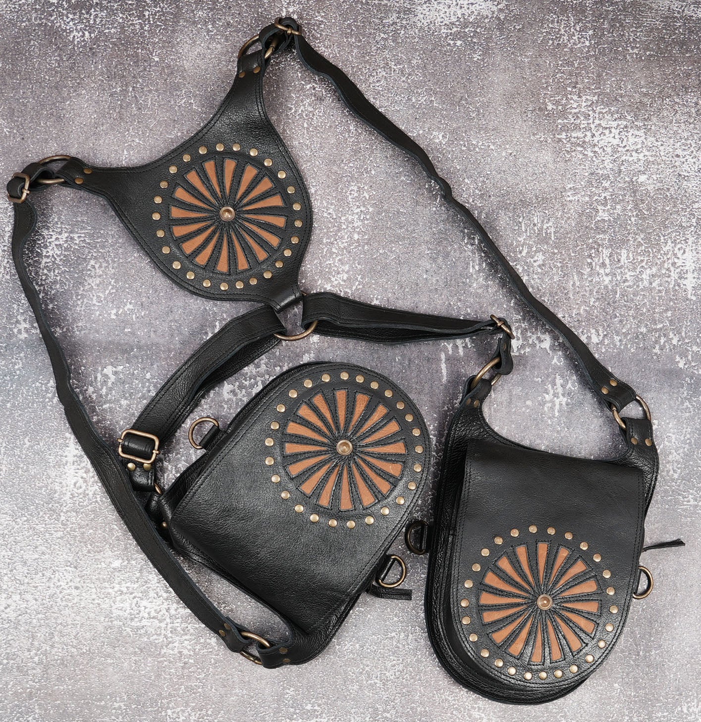 Leather holster belt with decorative radial stud pattern