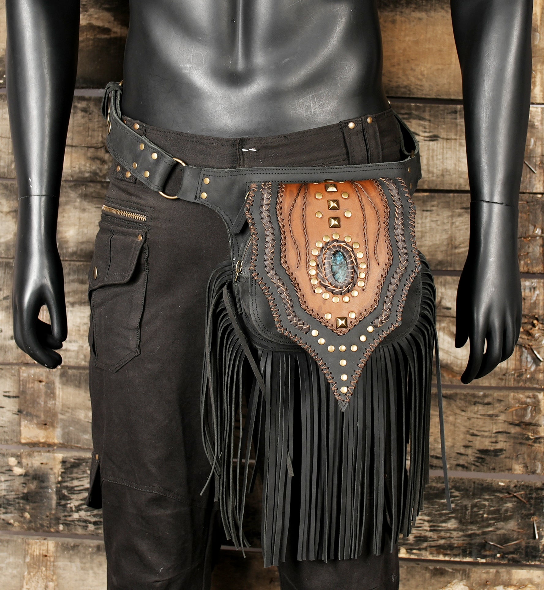 Festival-ready leather hip pouch with layered leather and gemstone.