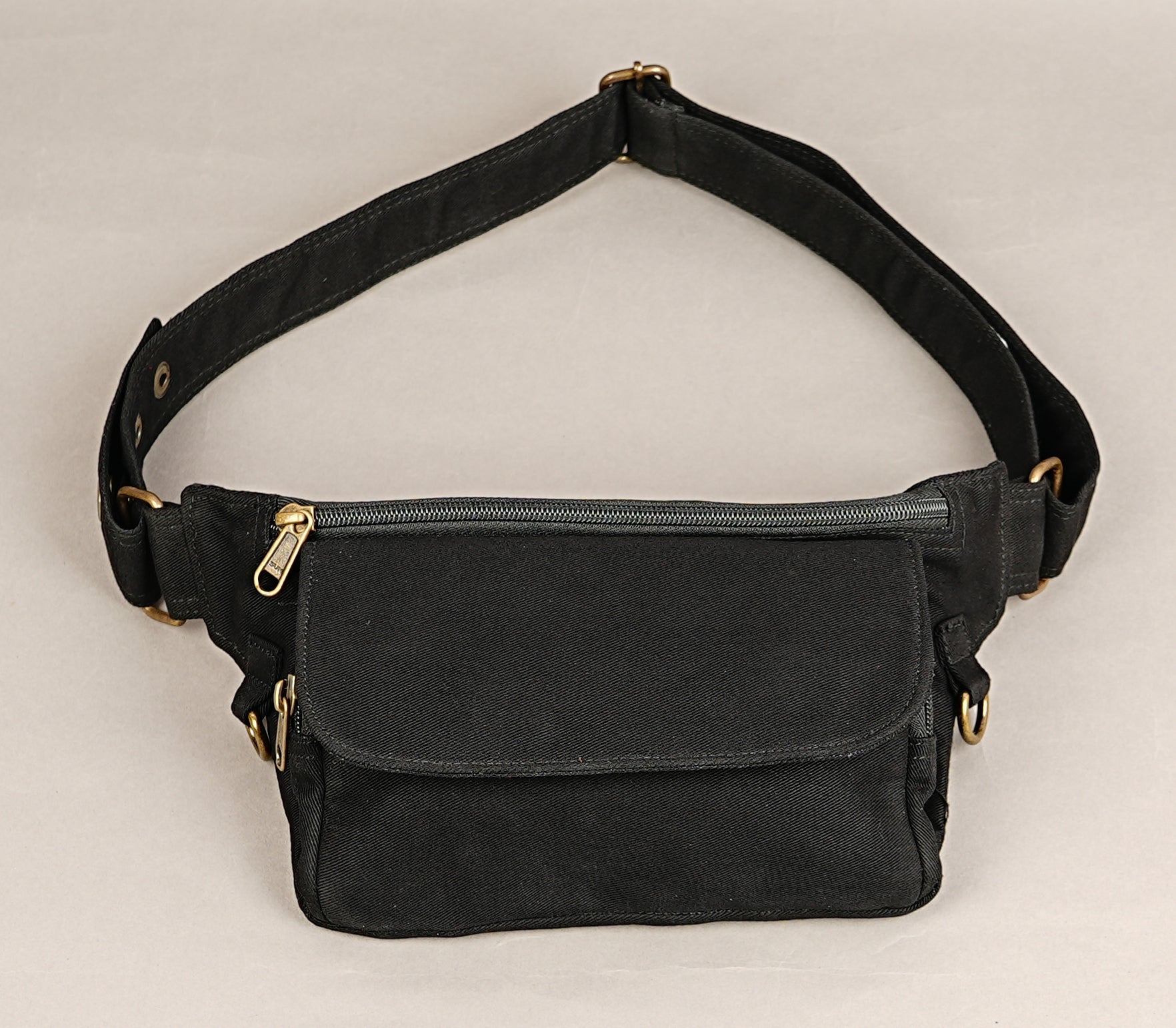 Unisex black cotton belt bag with antique brass rings and front pocket