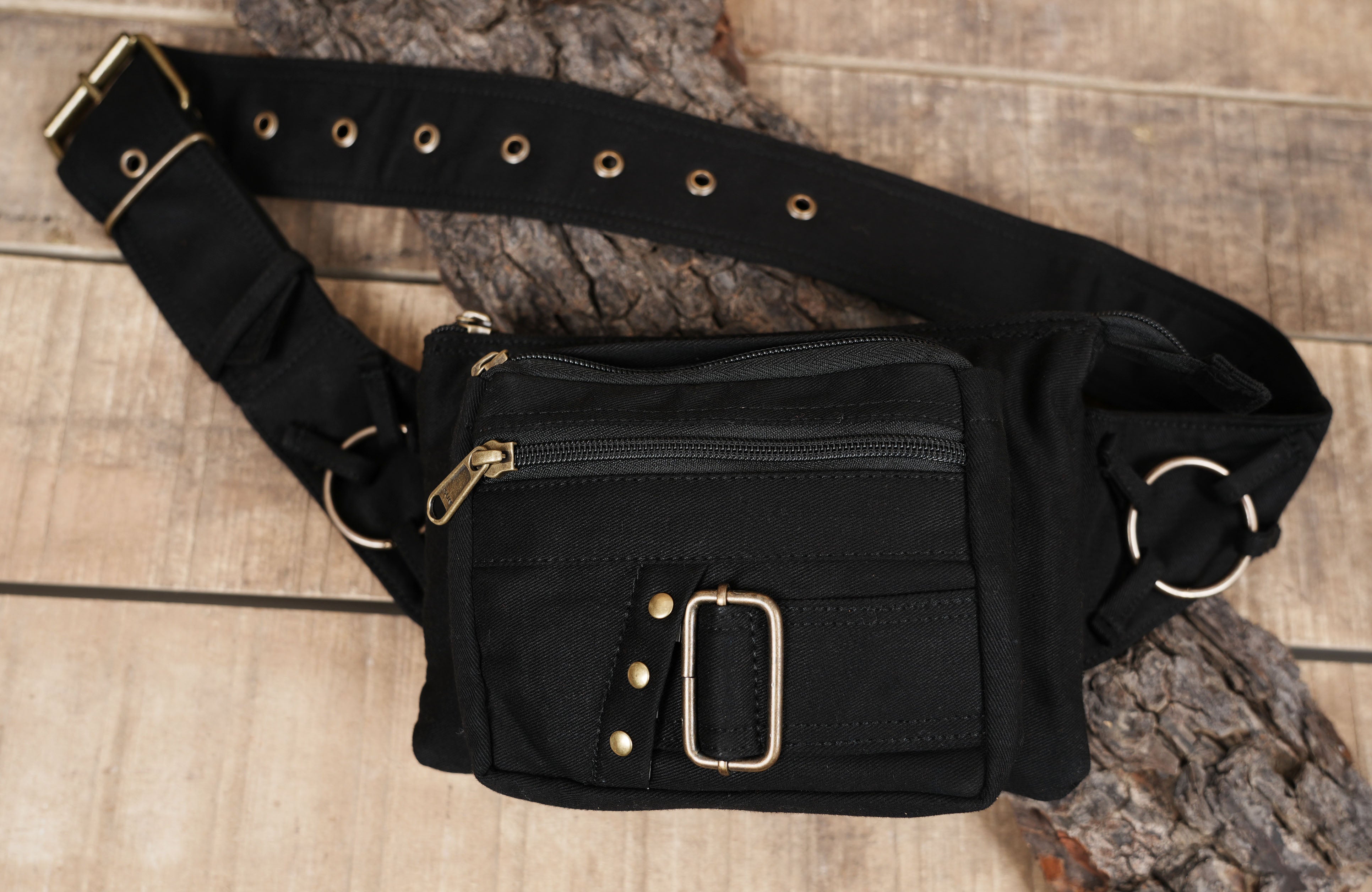 Rave and festival hip pack featuring multi-pocket black canvas design