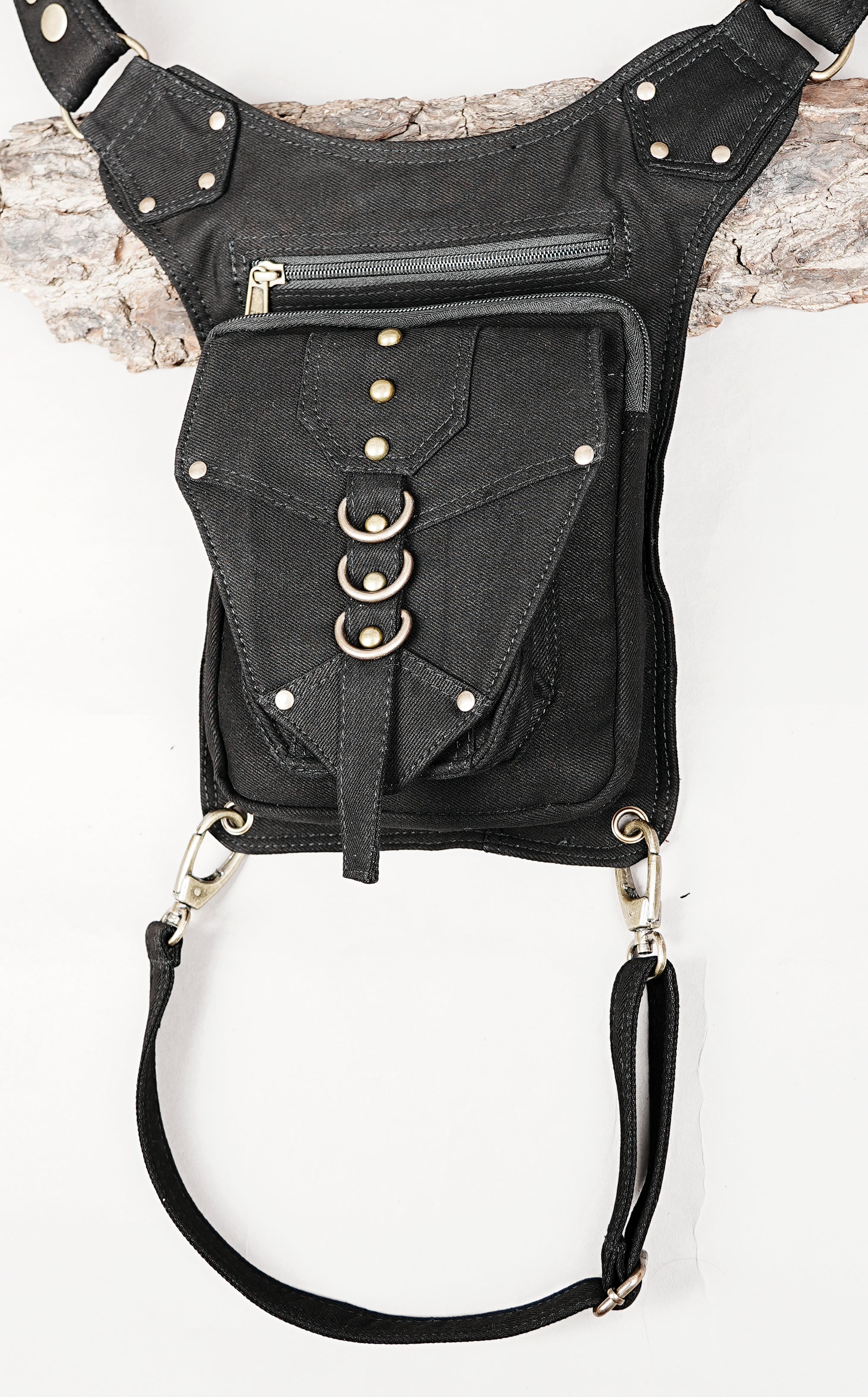 Unisex cotton canvas hip and thigh bag with multi-pocket zippered storage for travel.