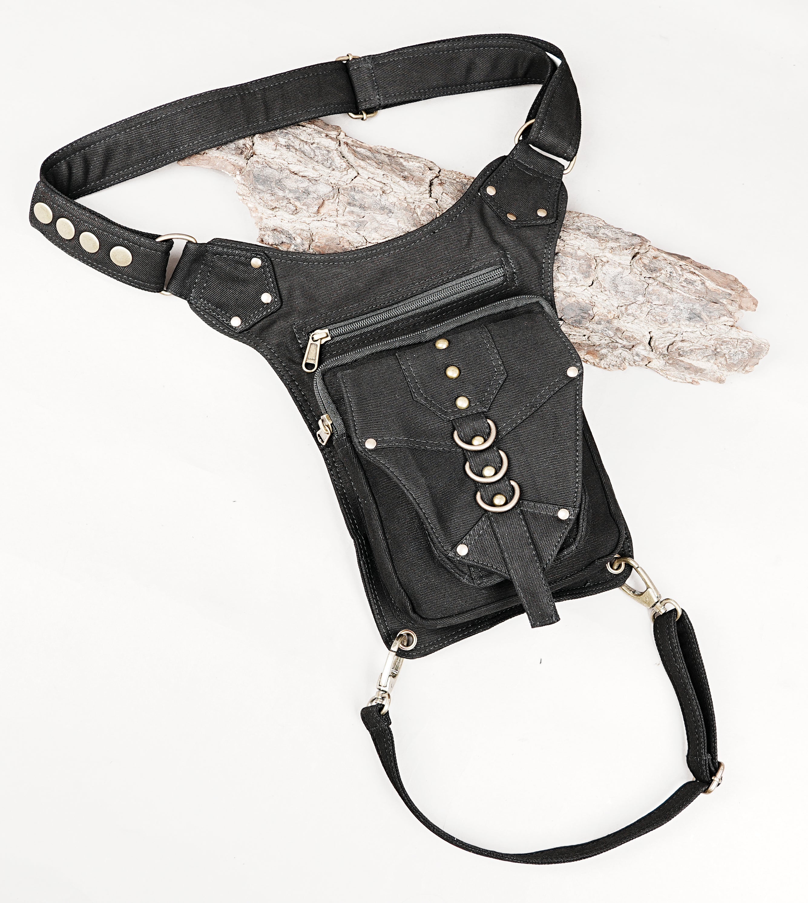 Black bohemian festival waist belt bag with secure detachable leg strap and metal rings.