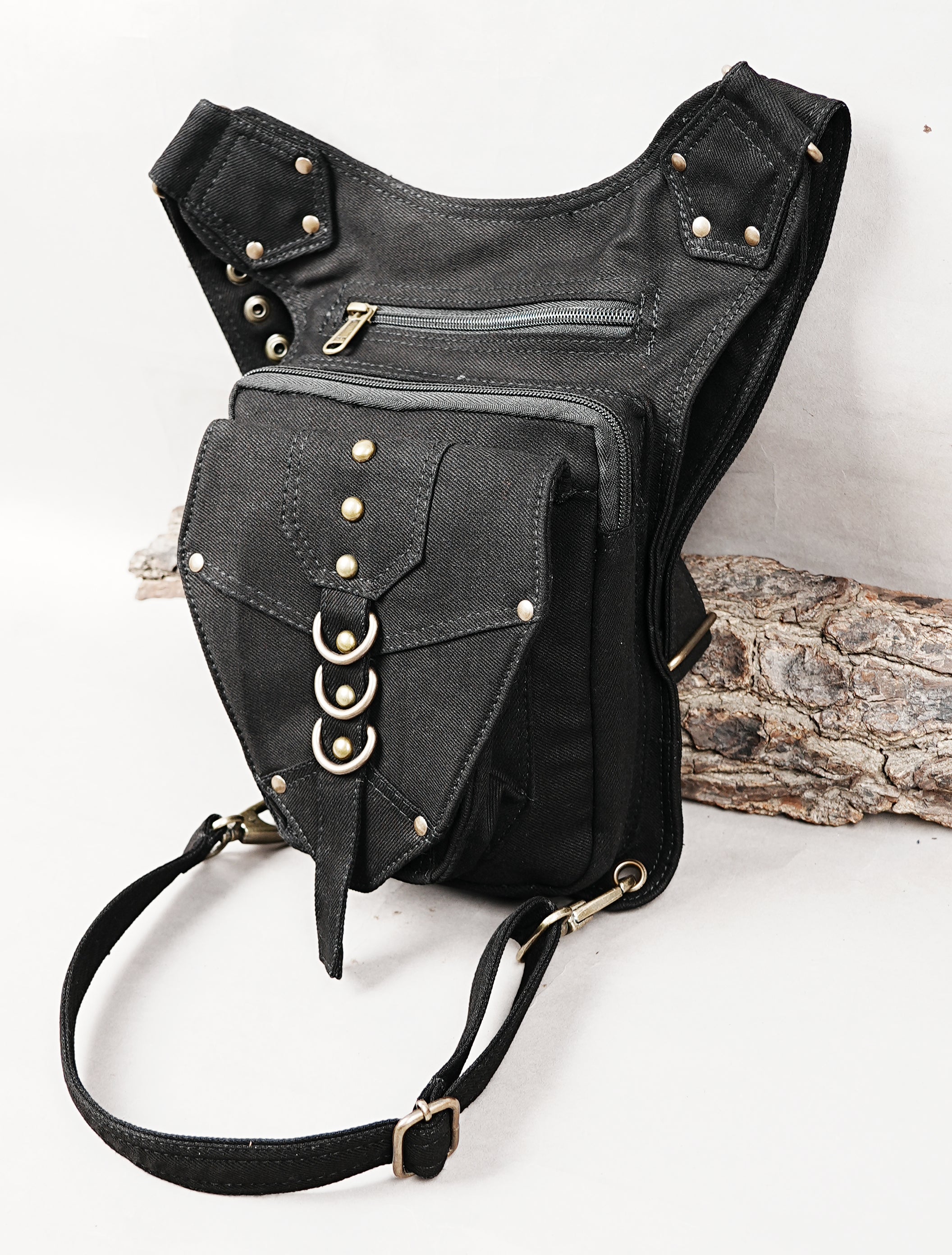 Hands-free festival utility hip pouch with adjustable waist and leg strap buckles.