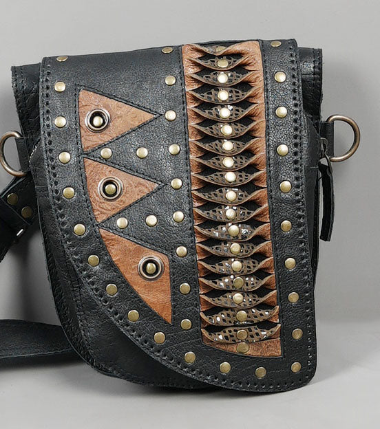 Artisan leather holster set with brown accent panels and studs