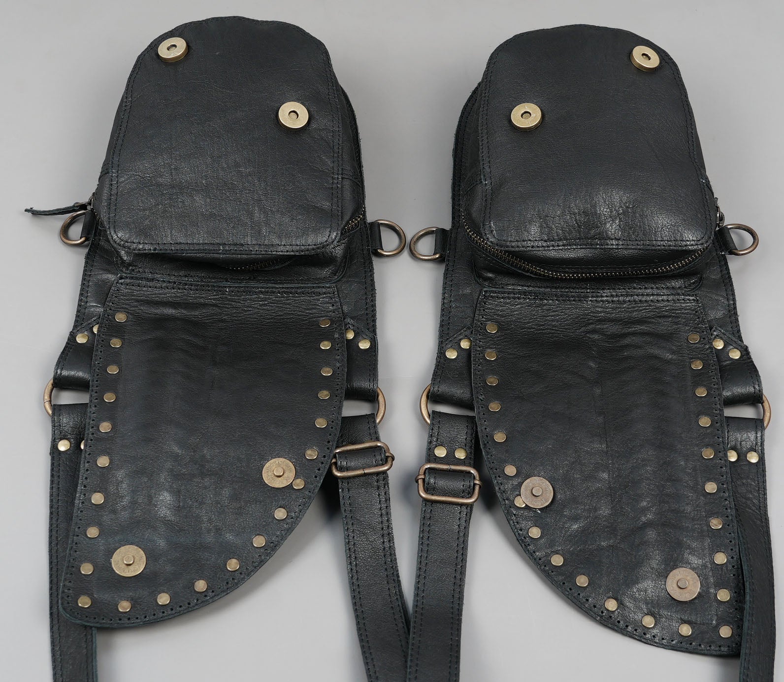 Dual pocket leather holster with antique brass rings