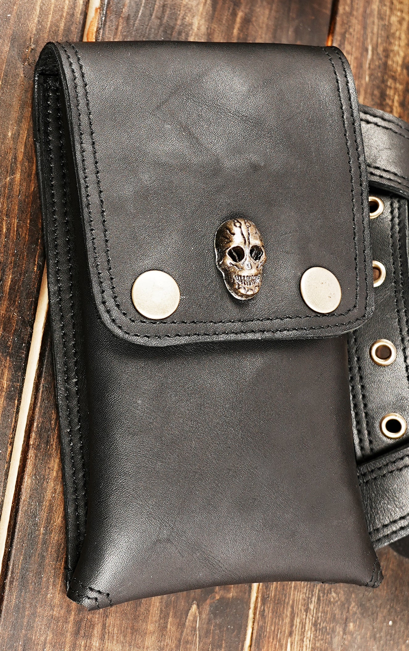 Gothic festival leather bag worn as shoulder holster