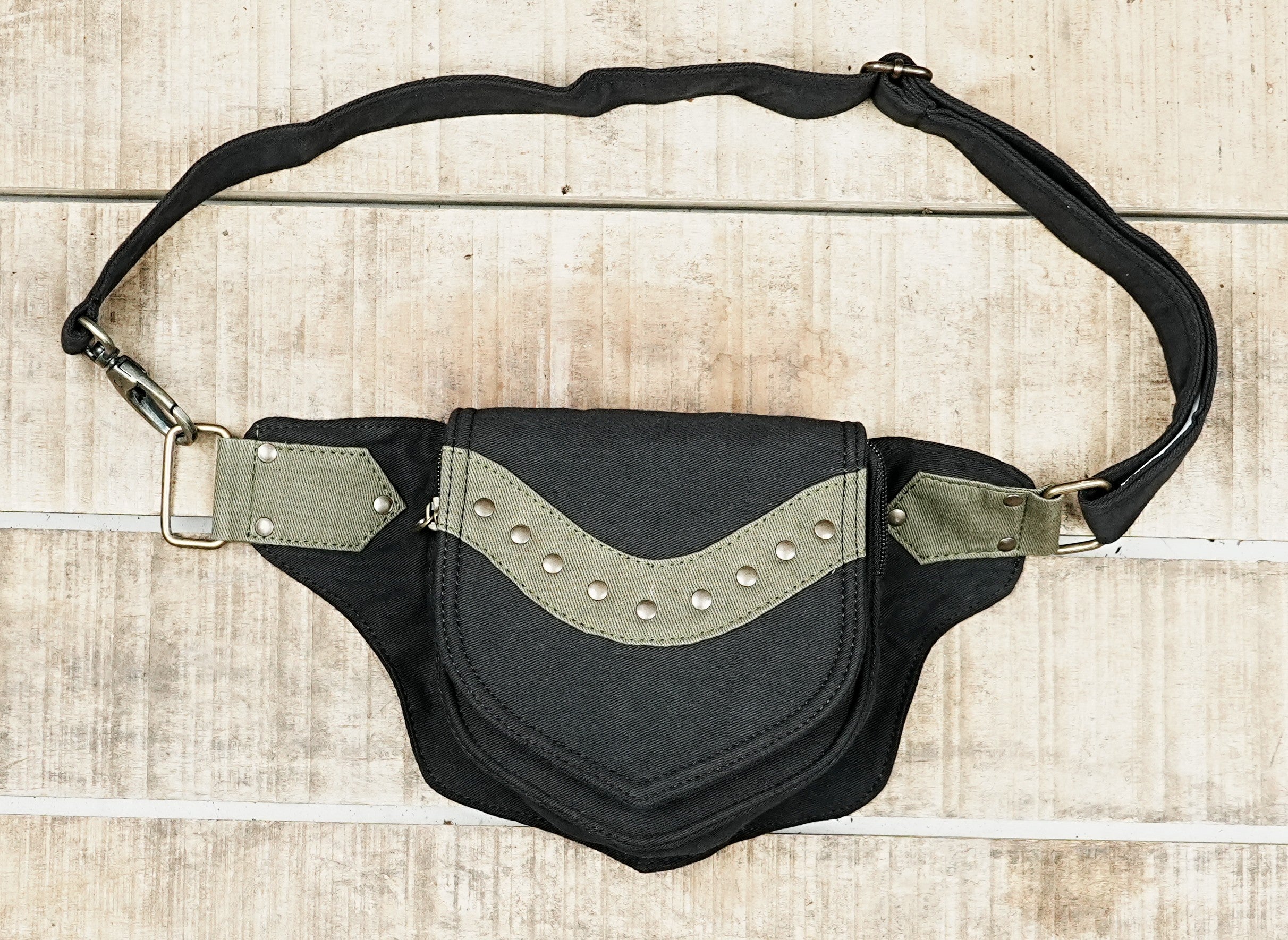 Festival waist pack with hidden back zip pocket on rustic wooden table
