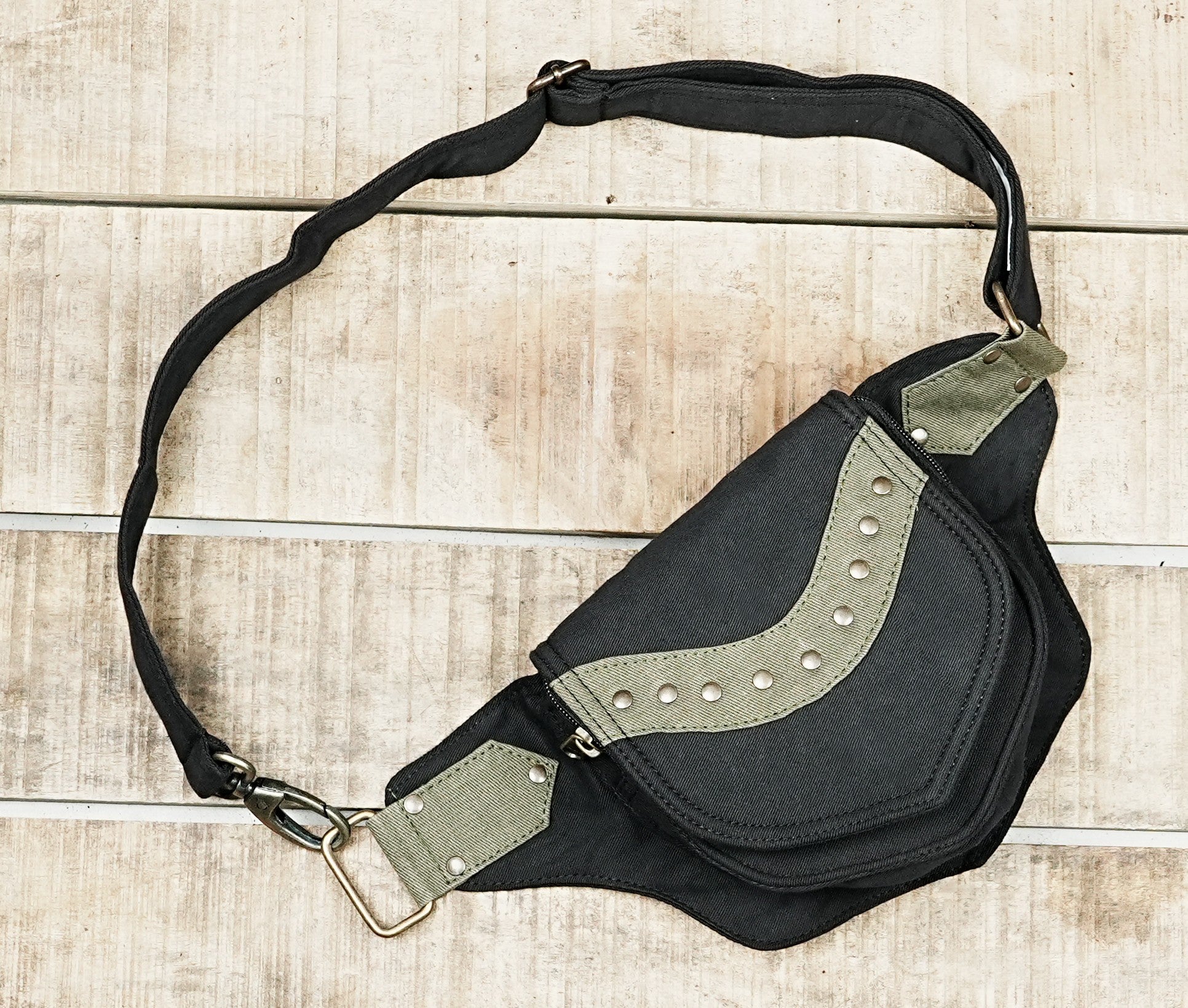 Streetwear utility pouch belt in black and olive canvas with metal studs