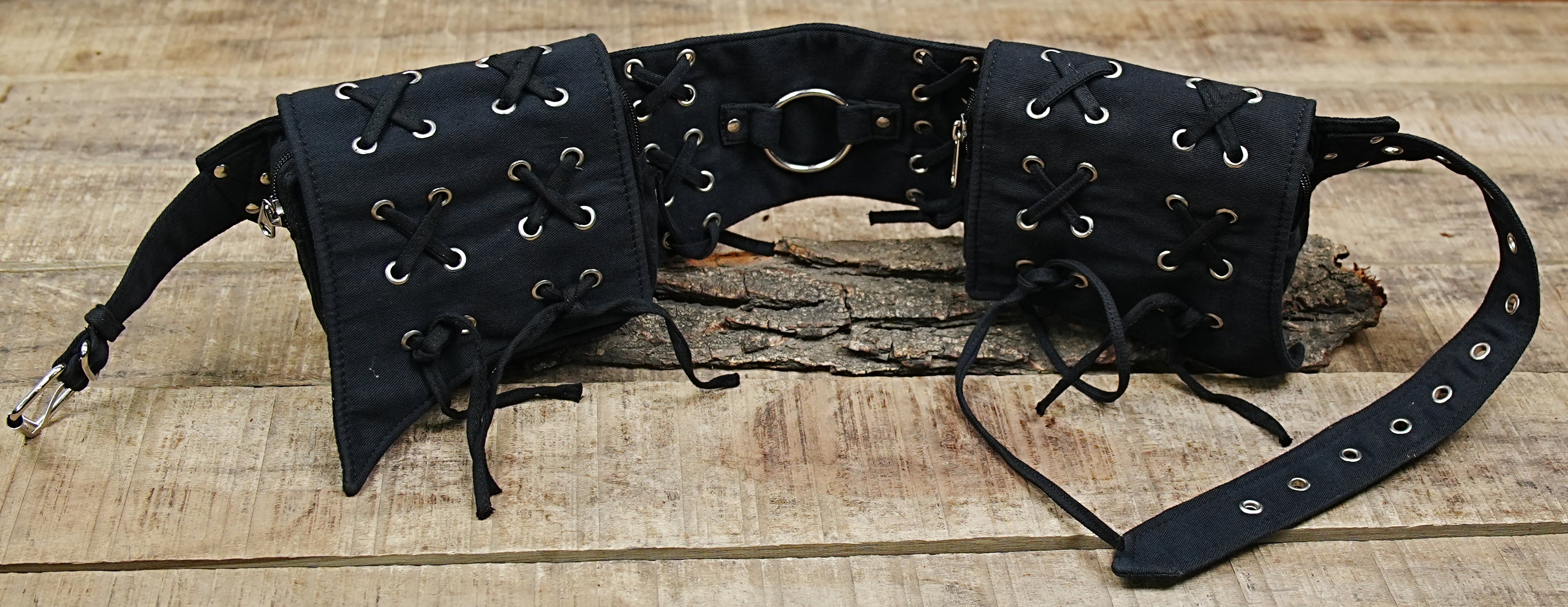 Low-profile black canvas utility belt for a modern, functional streetwear outfit.