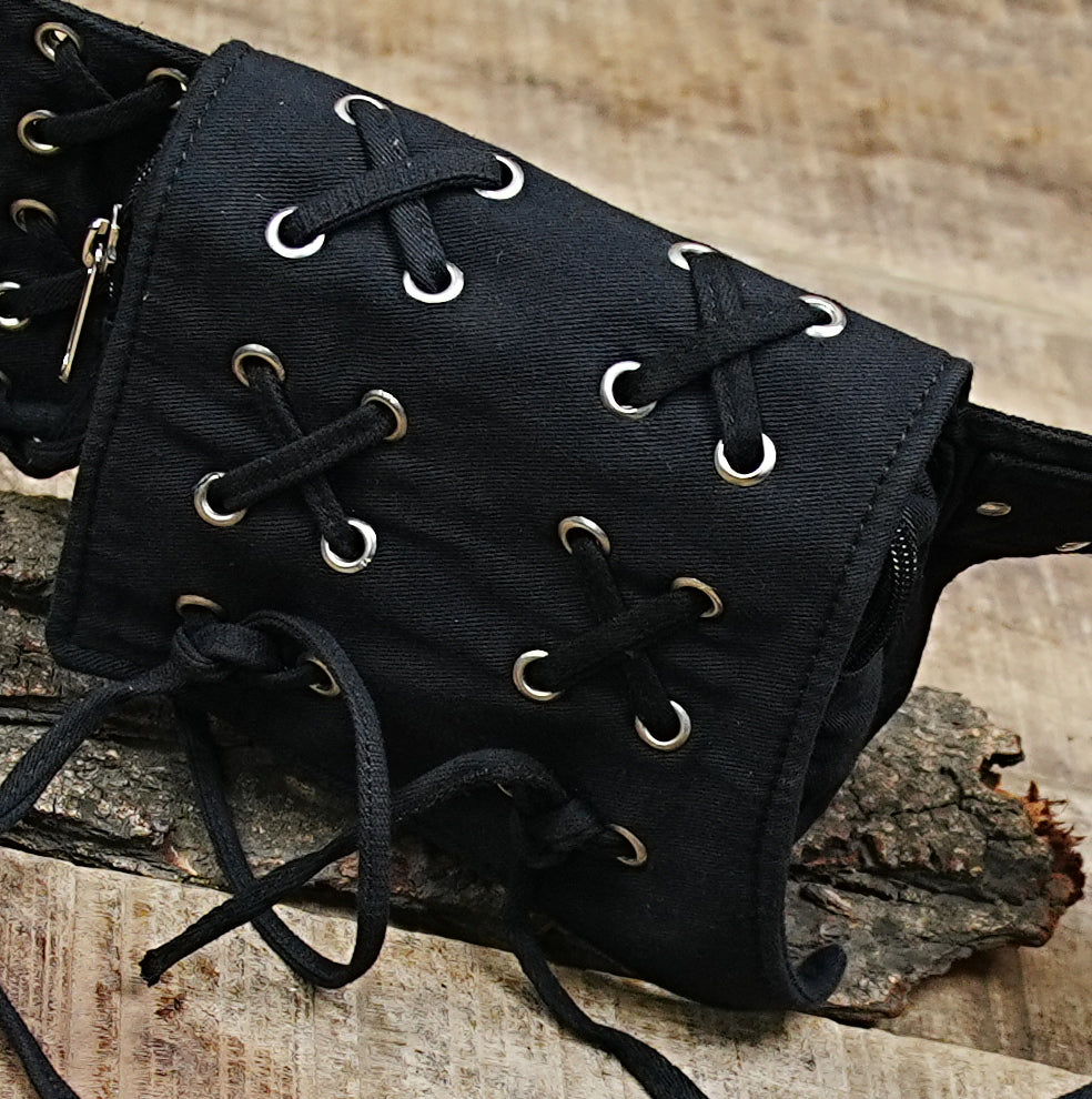 Multi-pocket waist bag made from strong, textured cotton fabric with reliable zipper and secure flap closures.