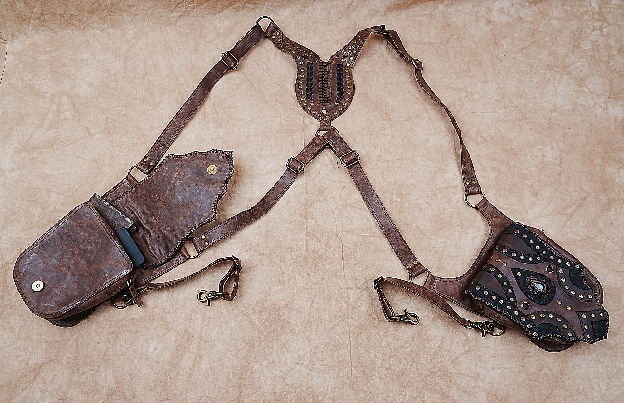 Boho leather hip holster with brass rivets and unique stone design