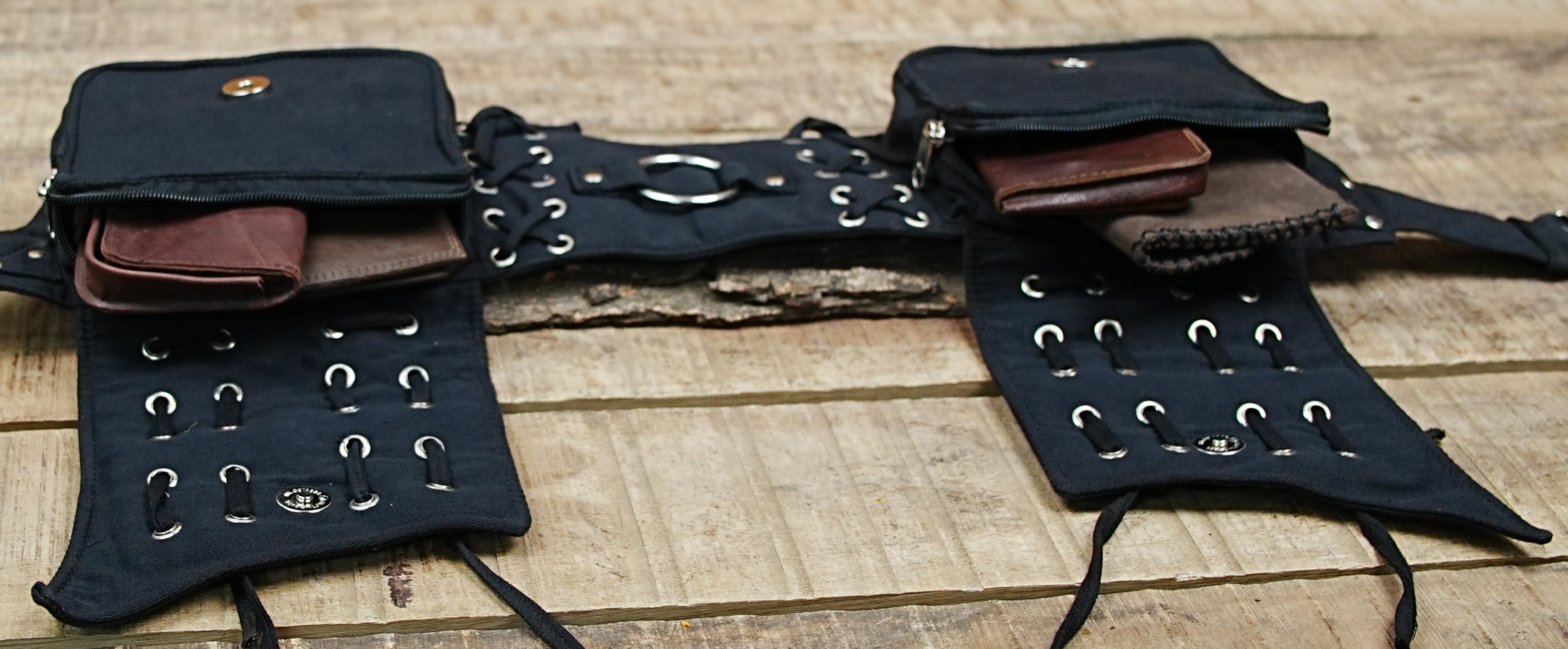 Hands-free festival must-have: an adjustable black canvas bum bag and utility pouch with metal hardware.
