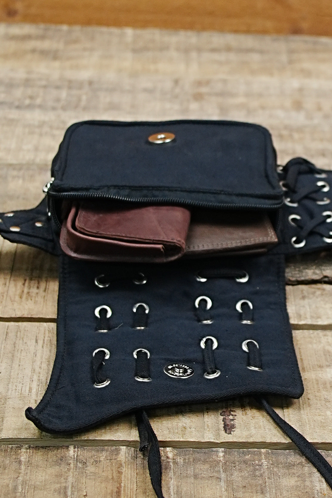 Secure travel companion: a multi-pouch black cotton bum bag / fanny pack with a durable canvas build.