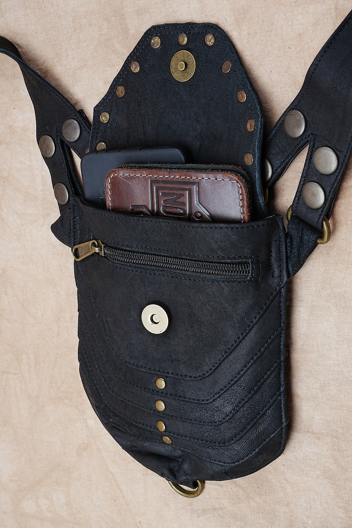 Adjustable black leather harness belt with metal hardware