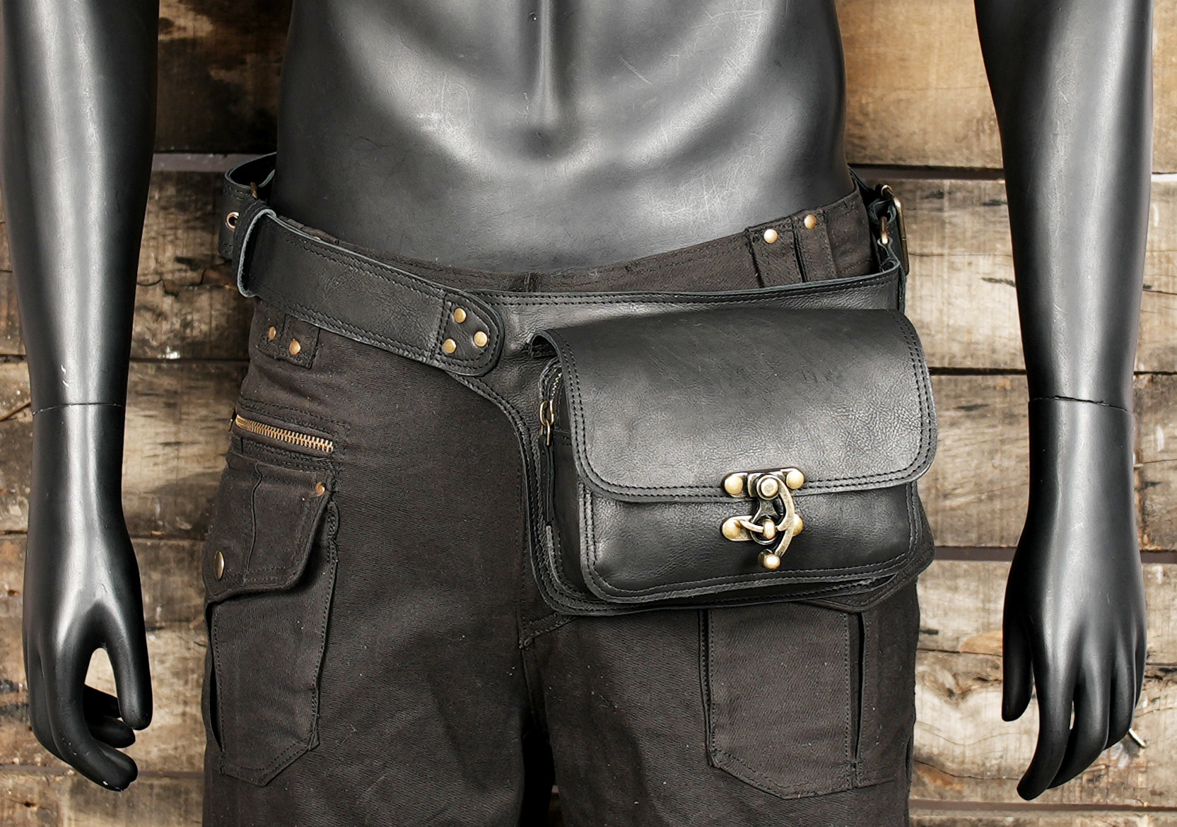 Handmade belt bag in black leather with brass fasteners