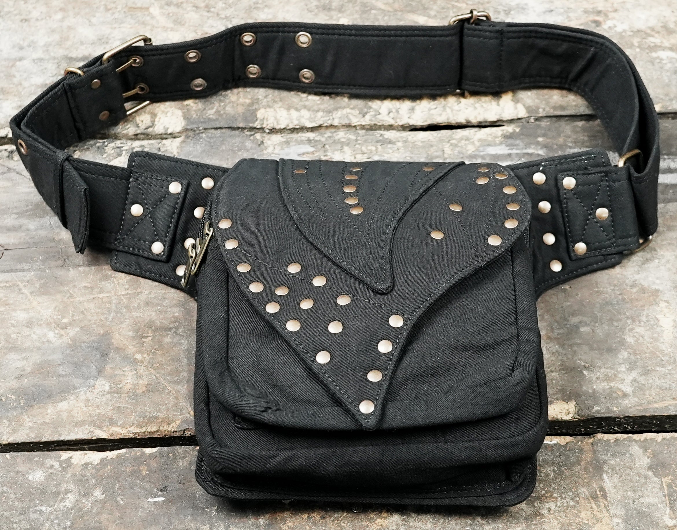 Studded canvas festival hip bag with pointed leaf flap and zipper pocket