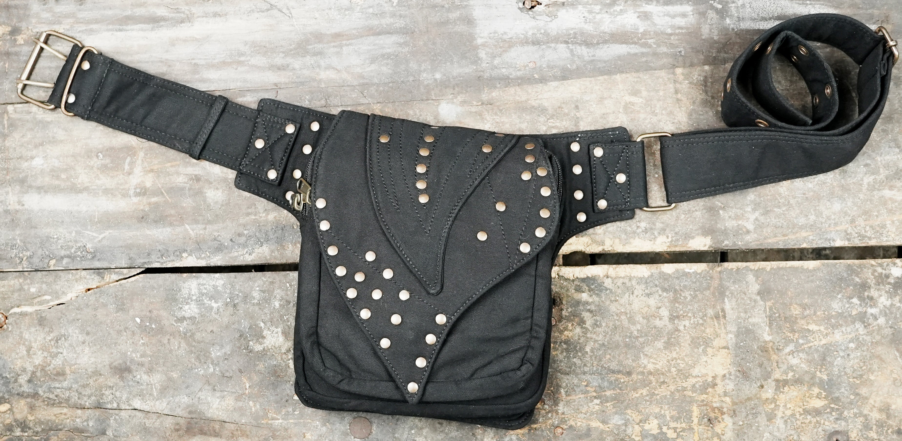 Unisex black canvas fanny pack with pointed snap flap and metal dome studs