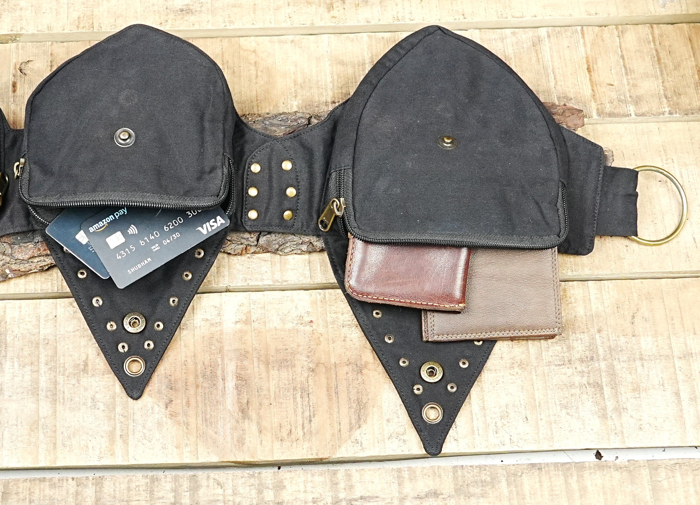 Rave bum bag featuring pointed triangular flaps with metal stud accents