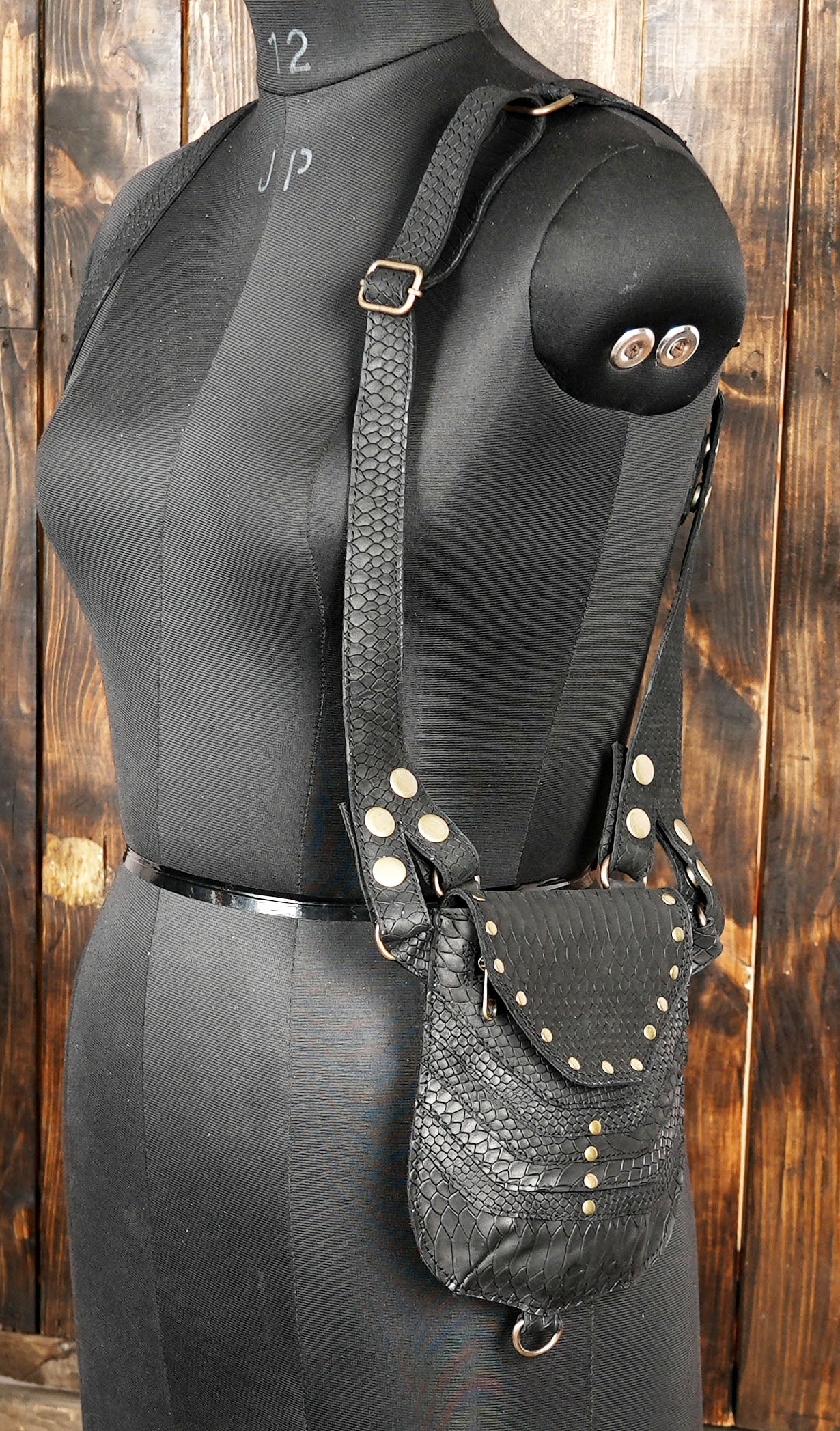 Hand stitched leather body holster with reinforced straps