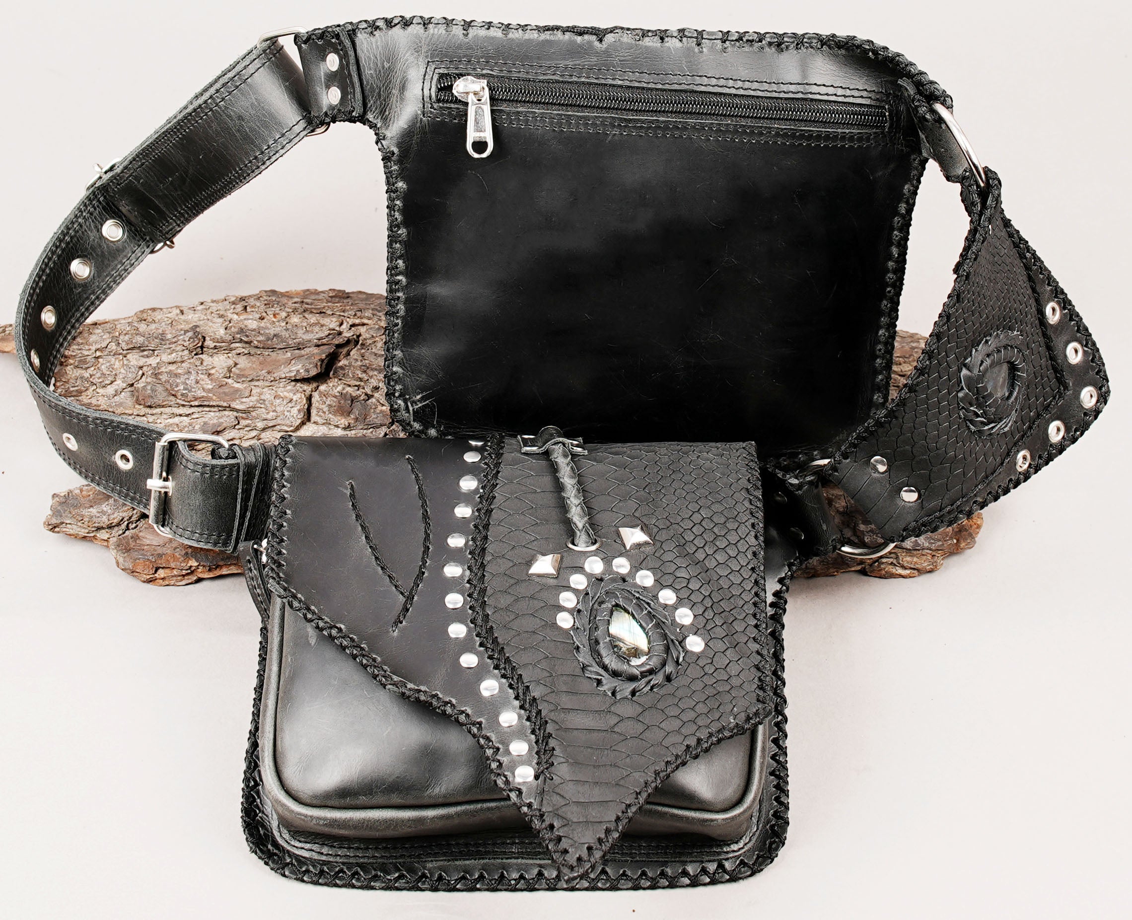 Black leather waist belt with braided stitching and metal studs