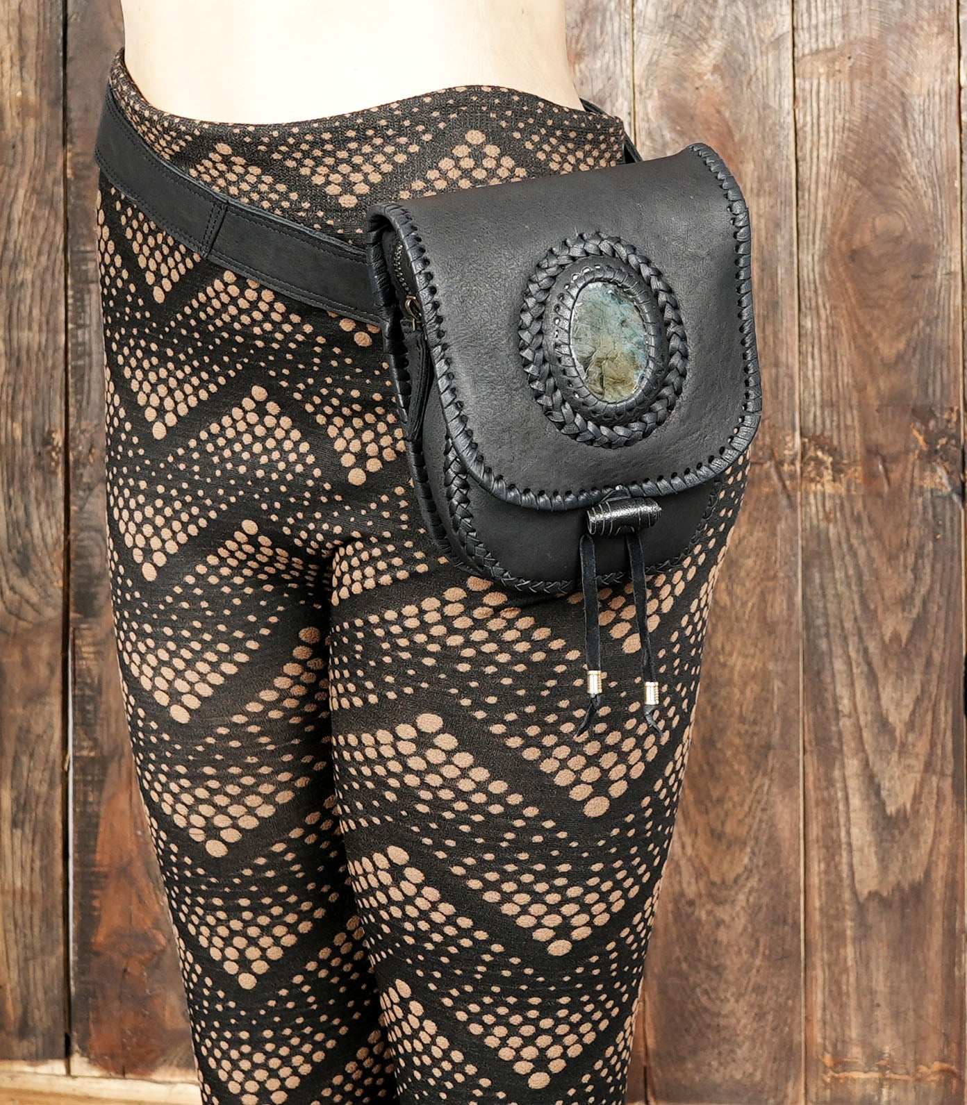 Vintage-style black leather hip bag with gemstone and tie closure