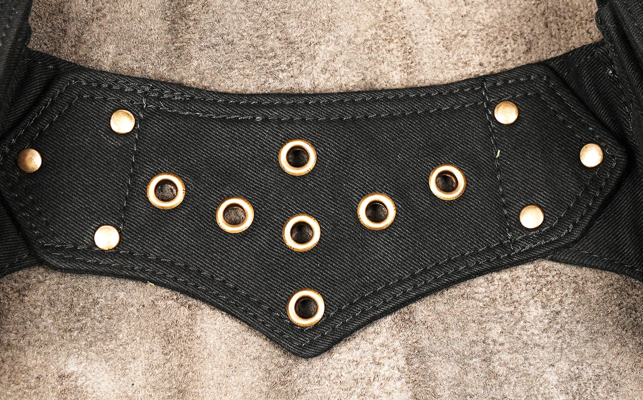 Cotton hip belt with several utility pouches, snap closures, eyelets and brass-tone hardware