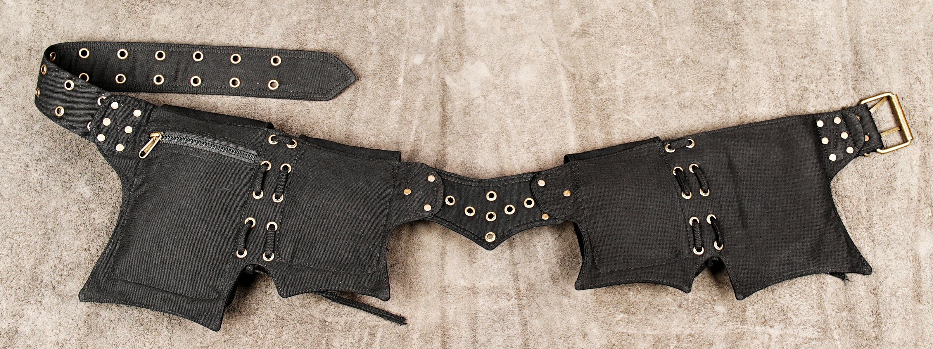 utility belt showing pocket pouches, snap closures, zipper and antique brass-tone metal details
