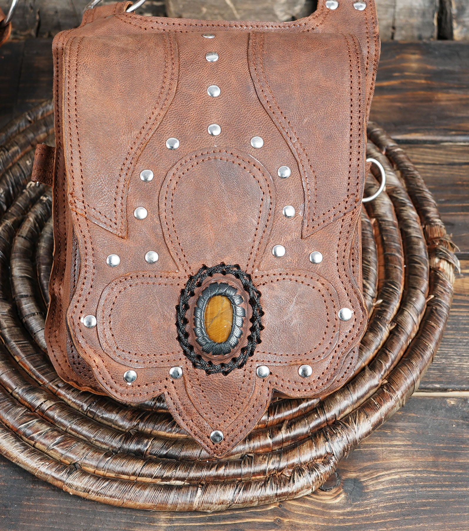 Boho-style leather holster bag featuring gemstone detailing and vintage finish
