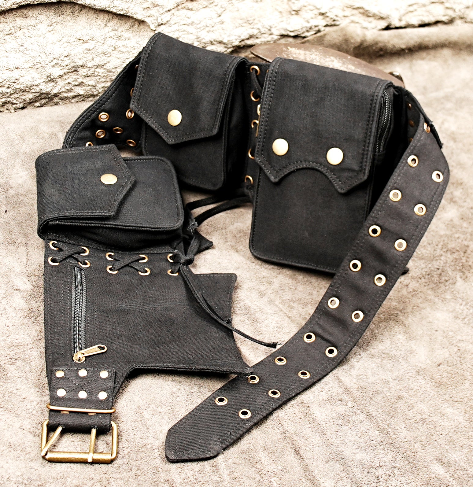 waist pouch belt with several compartments, brass-tone buckle and metal eyelets
