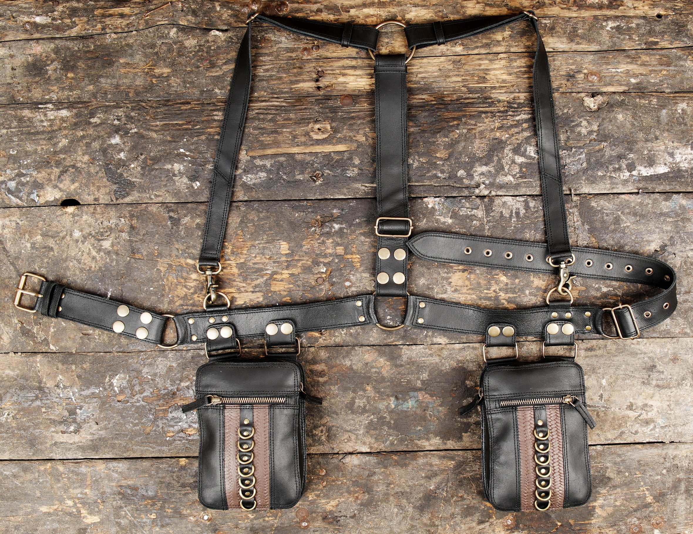 "Black leather holster harness with dual pouch pockets"