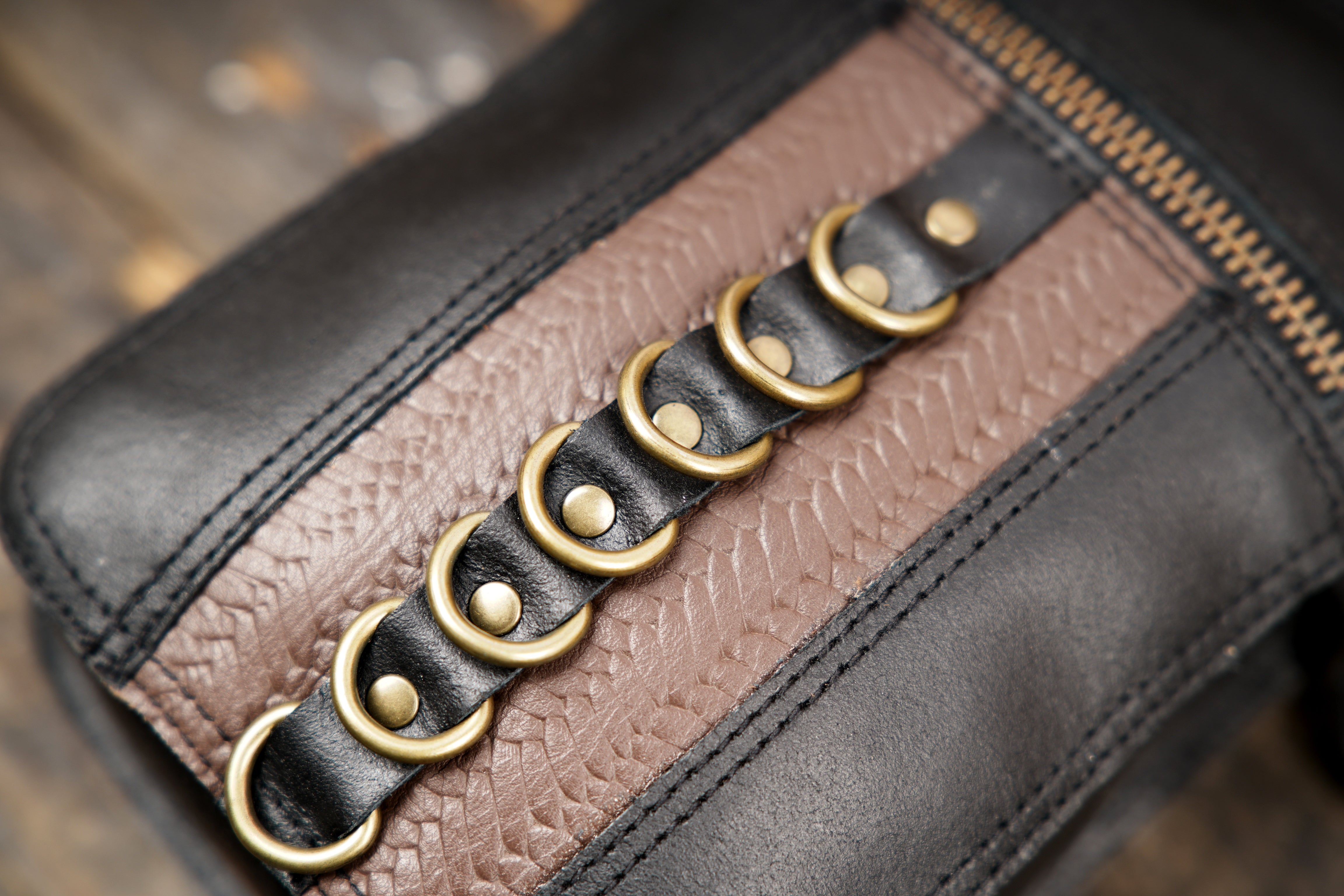 "Adjustable leather holster belt with two storage bags"