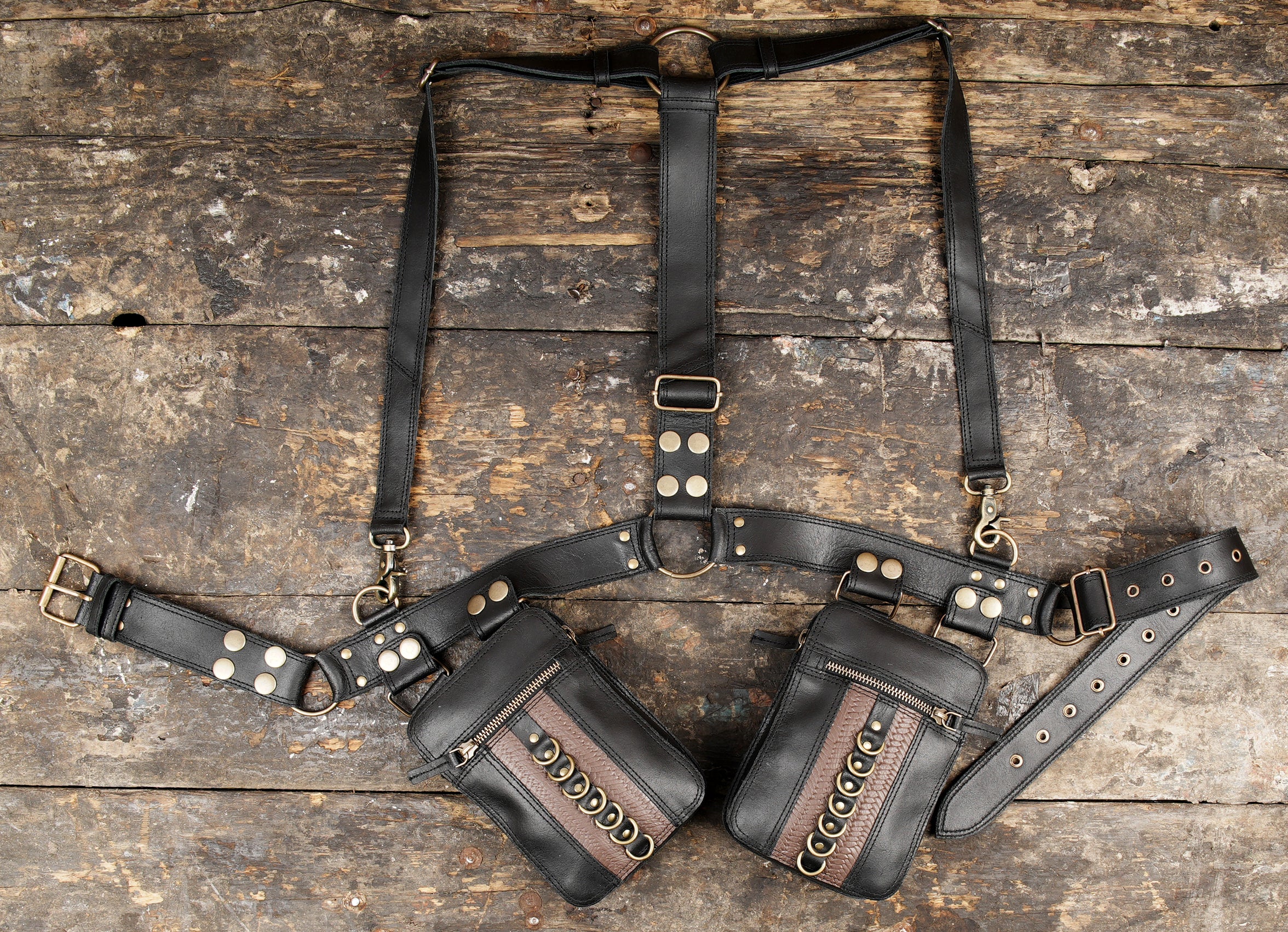 "Black tactical leather holster with adjustable straps"