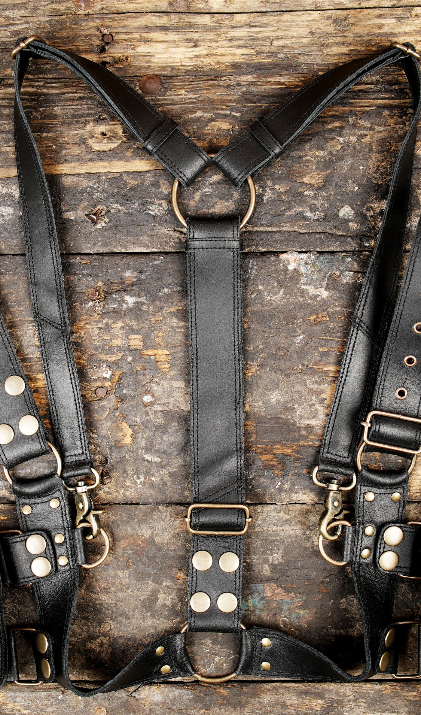 "Handmade leather holster harness for travel and festivals"