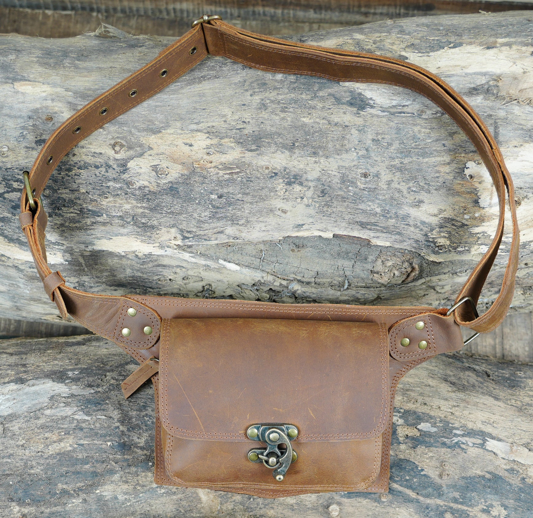 Sleek black leather hip pouch with adjustable buckle