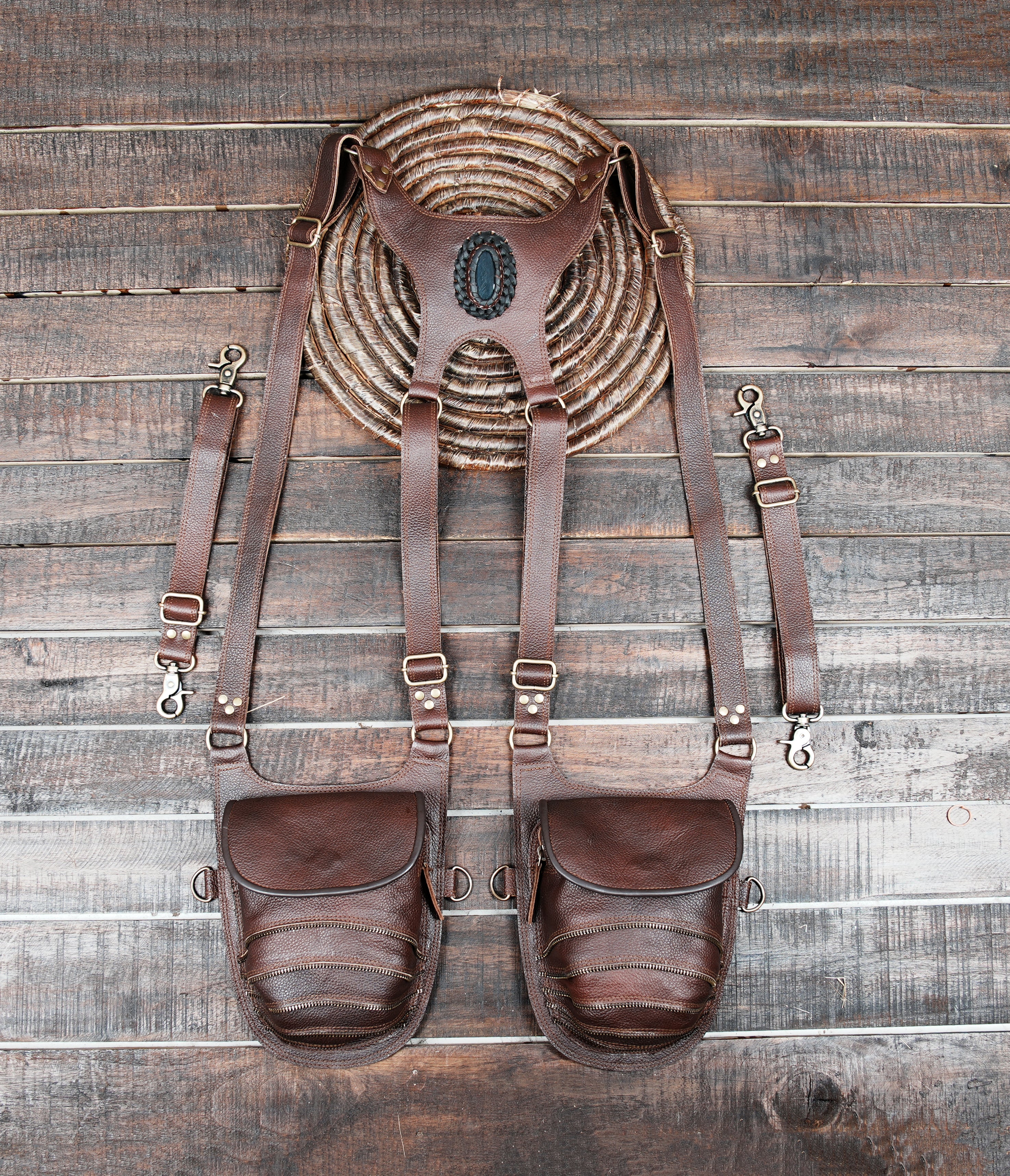 Brown leather shoulder holster bag with dual pouches and adjustable straps