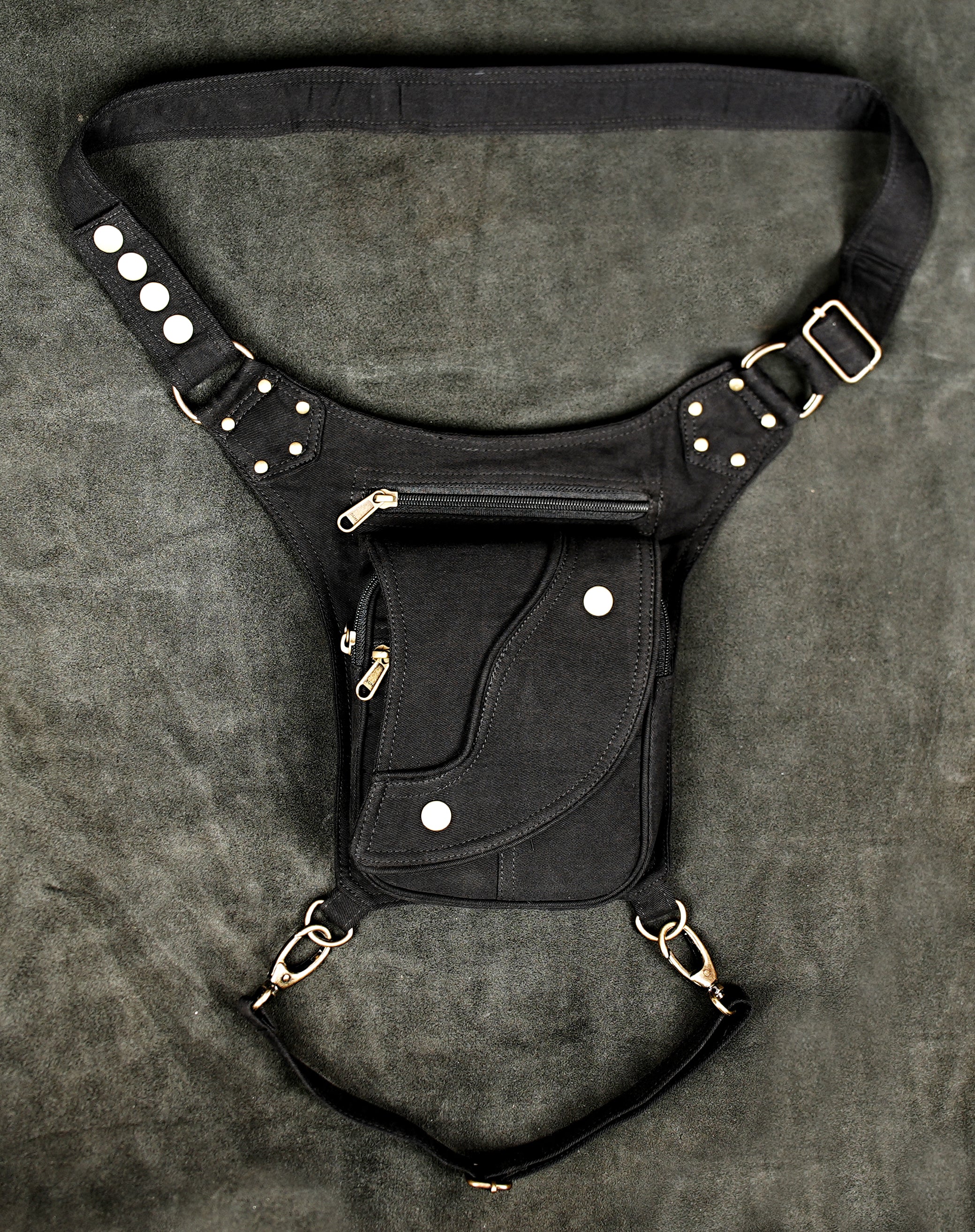 Hands-free black canvas hip pouch with two zipper pockets and leg strap