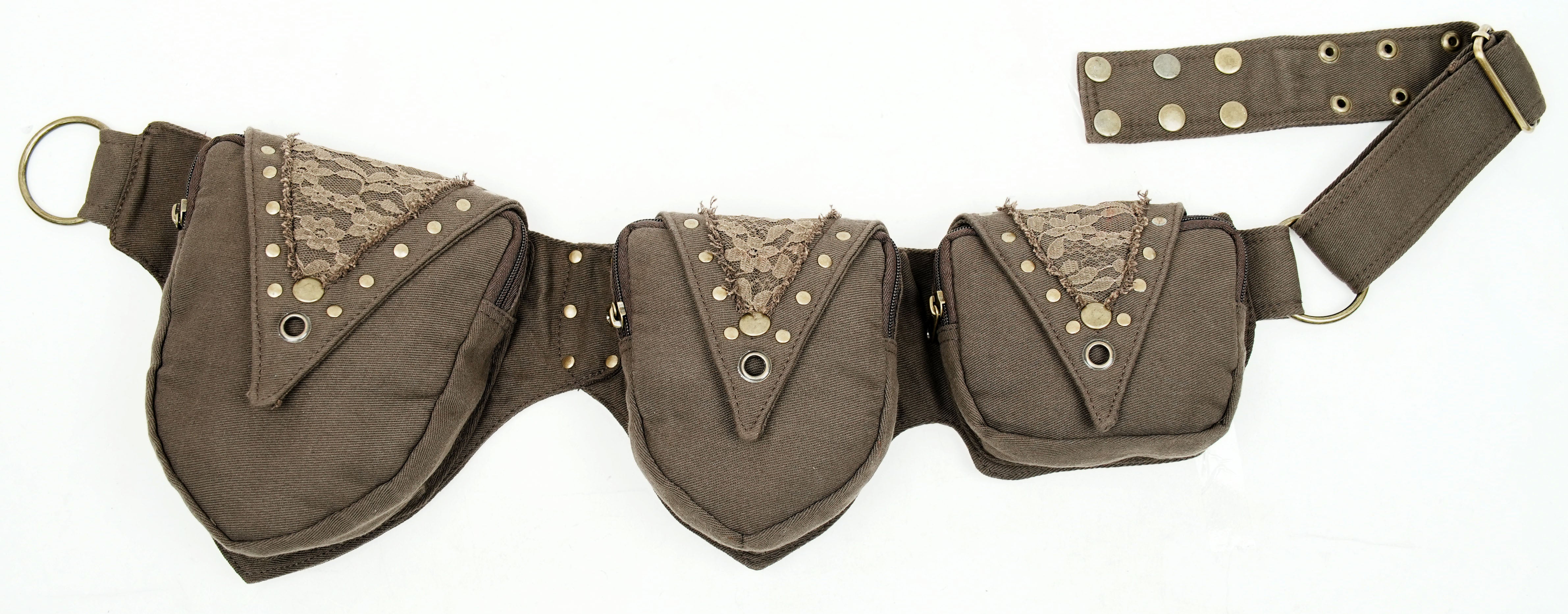 Flat lay of cotton canvas utility hip belt with brass hardware detailing