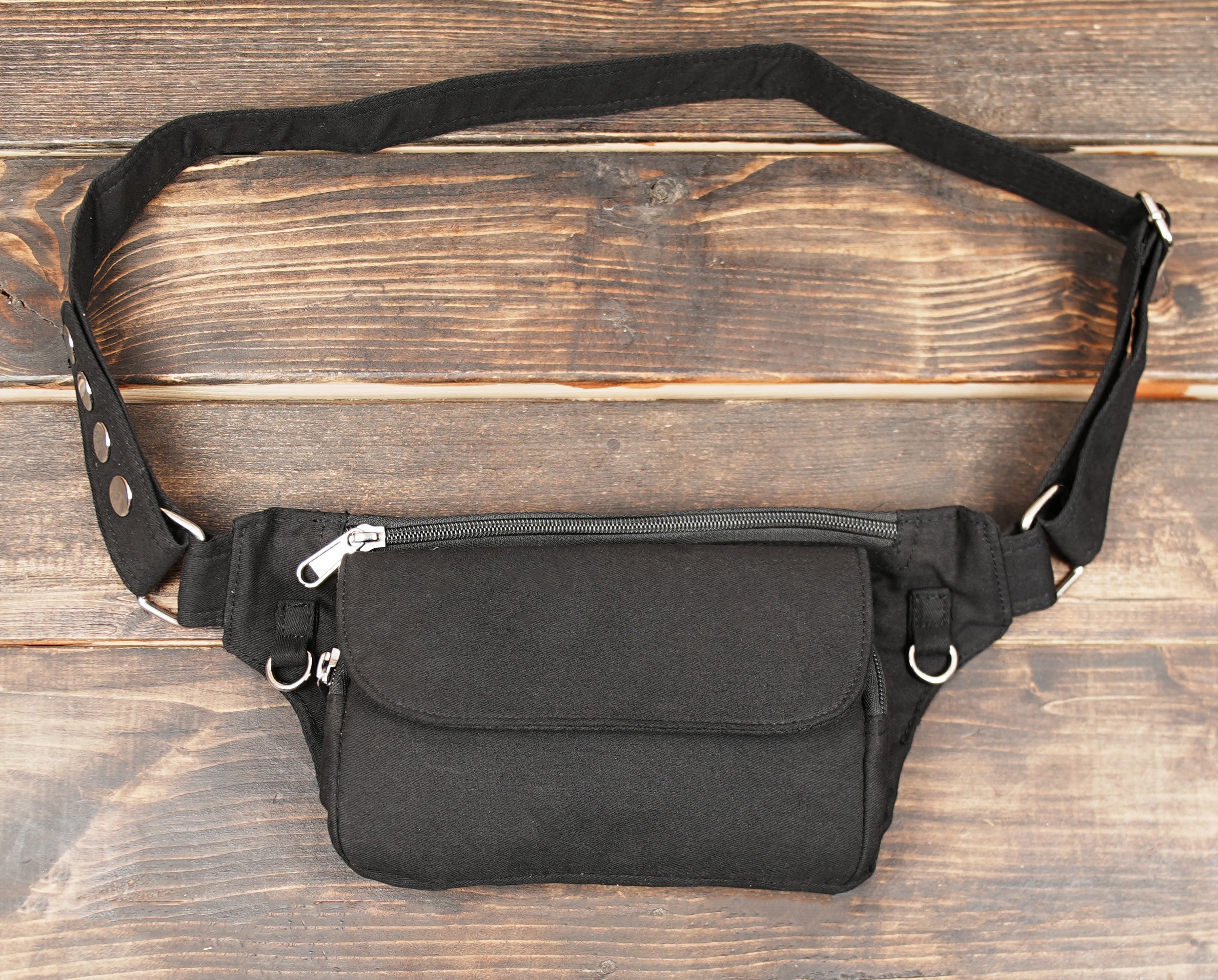 Black minimalist fanny pack made from cotton canvas with adjustable strap