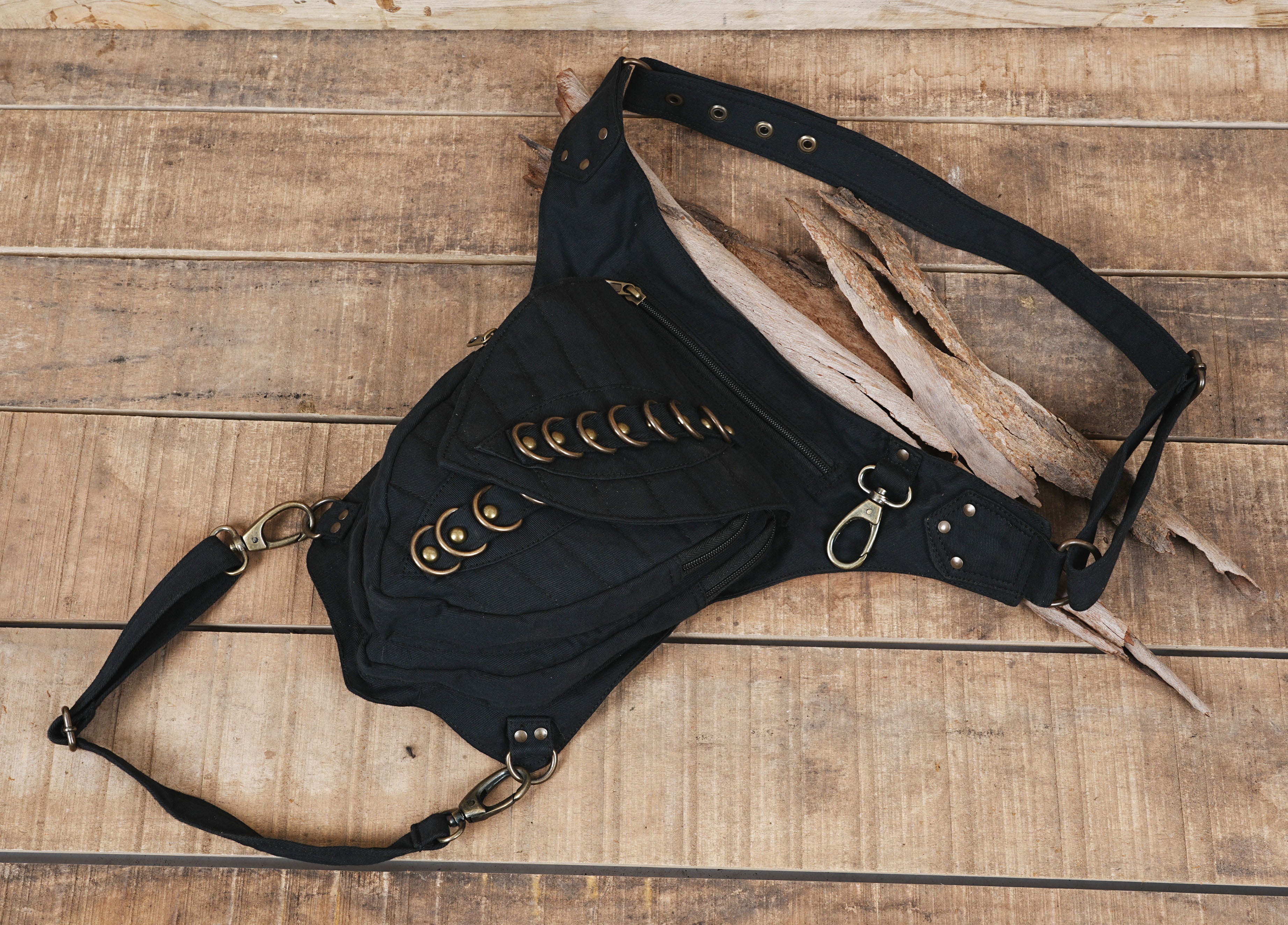 Biker style cotton thigh bag with antique brass swivel clips and zip pockets.