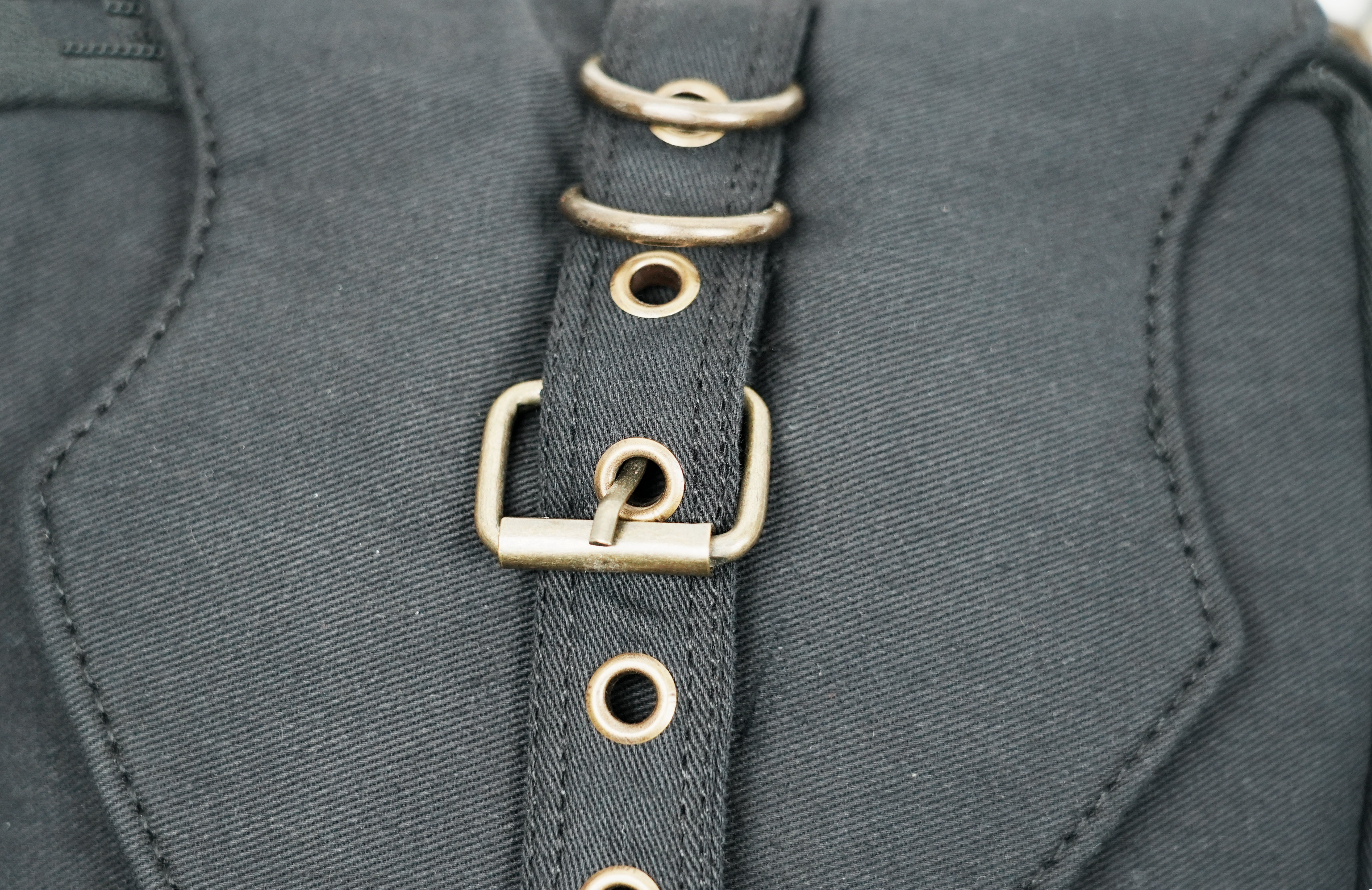 Steampunk style canvas crossbody bag with adjustable straps and secure compartments