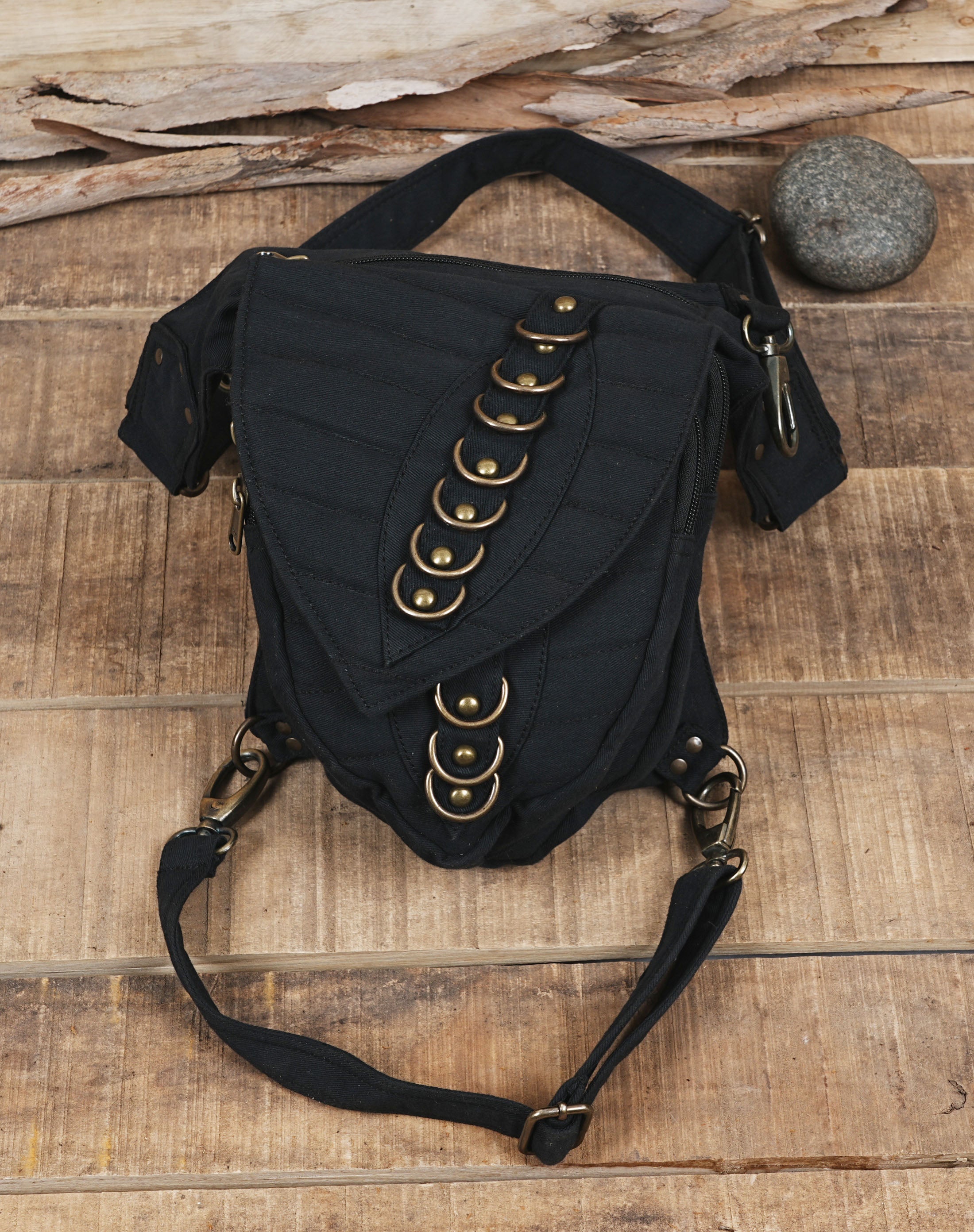 Unisex cotton canvas hip and thigh bag with multi zippered travel pockets.